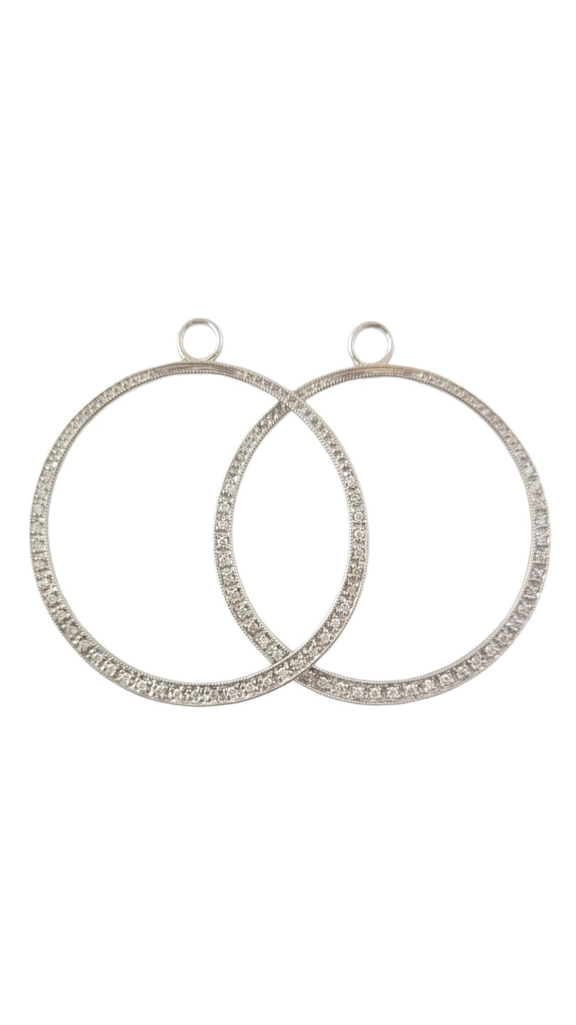 Vintage 14K White Gold Hoop Enhancers / Charms for Stud Earrings -

These classic hoop accessories with 70 sparkling round brilliant diamonds frame the face with elegance when paired with some beautiful studs!

Approximate total diamond weight: .50