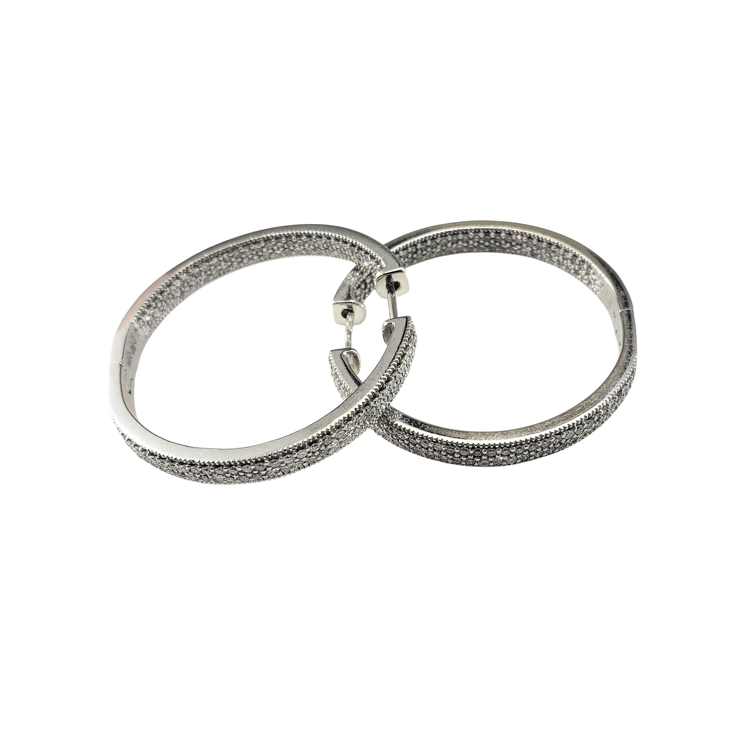 14K White Gold Inside-Out Diamond Hoop Earrings-

These dazzling 14K white gold hoop earrings each feature 123 round single cut diamonds set both inside and outside for maximum brilliance from every angle. A glamorous statement piece perfect for