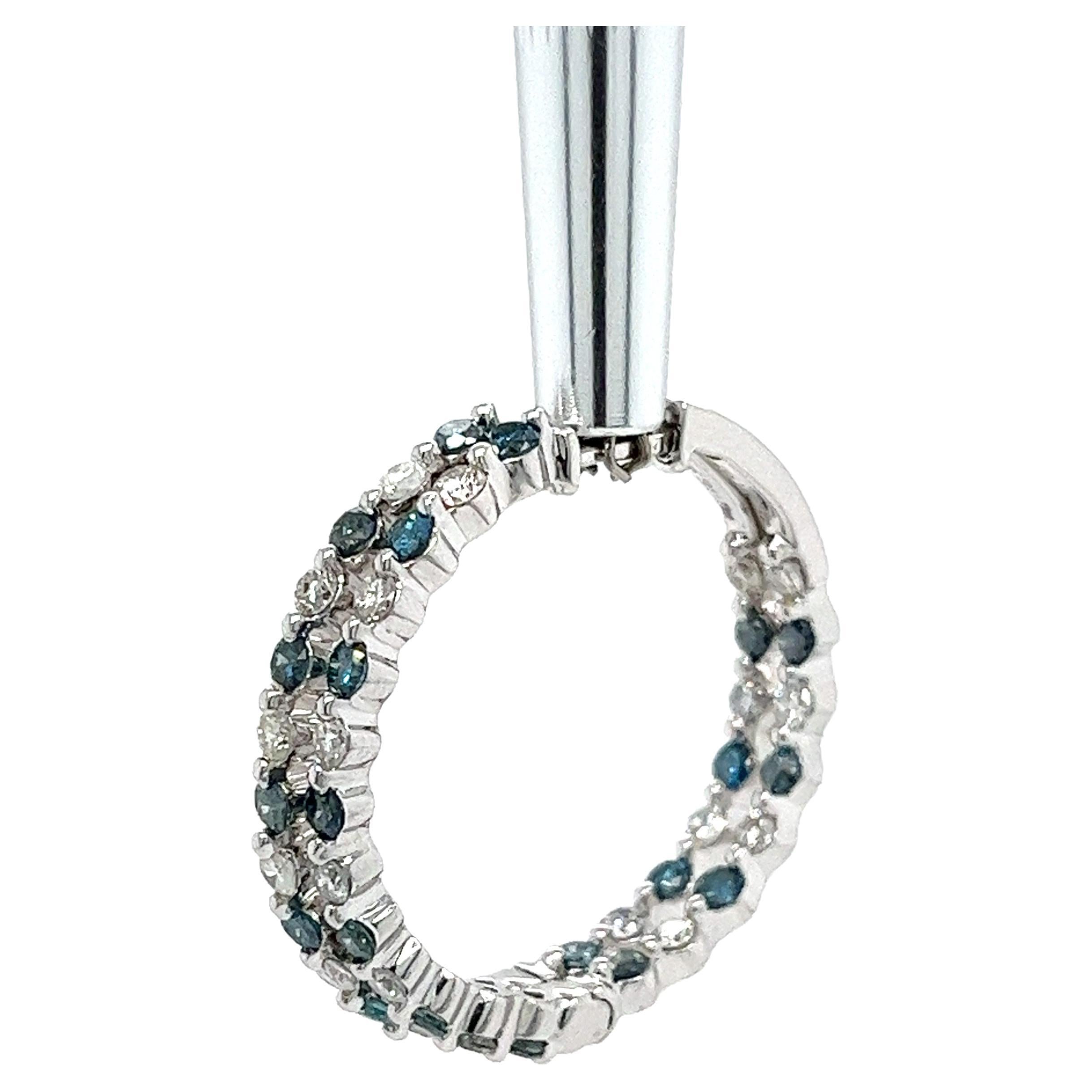 14k white gold sets 42 natural blue and white diamond inside out set hoop earrings. A gorgeous piece with expert jewelry engineering of color & symmetrical contrast. 

These earrings masterfully feature the diamonds on the front and interior back,
