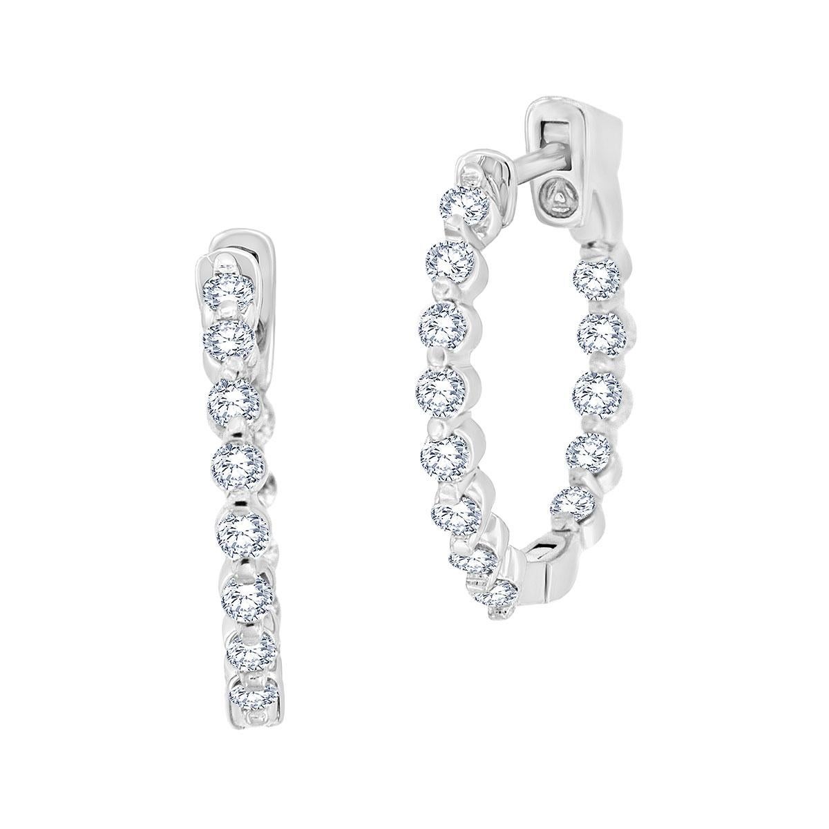 Featuring a 0.85-carat total weight of a full-cut diamonds. A sparkling row of shared prong diamonds on the outside the hoop and a sparkling row of shared prong diamonds inside the hoop.

Product details: 

Center Gemstone Type: NATURAL