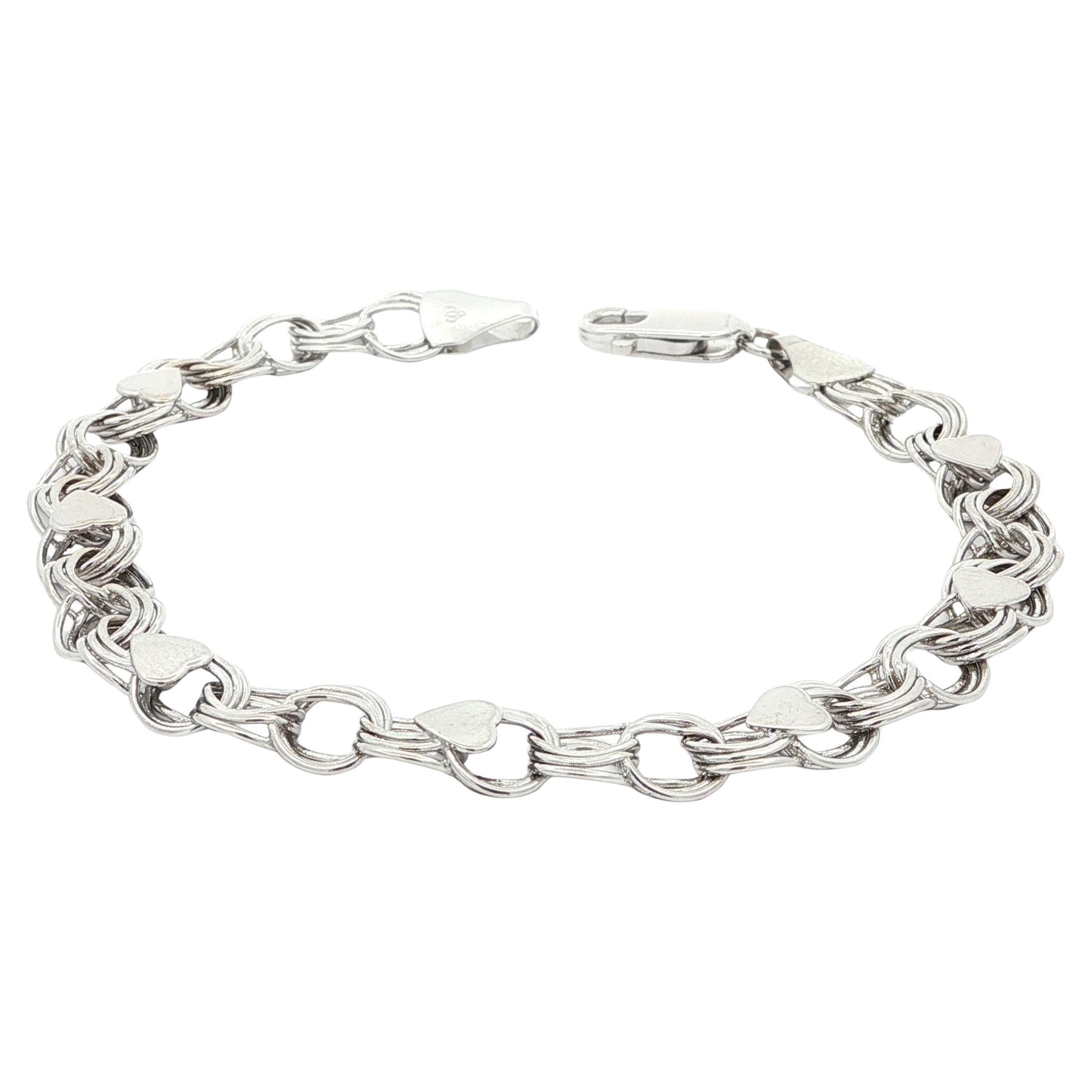 Pulsera de oro blanco de 14 quilates con eslabones circulares entrelazados y colgante estilo corazón