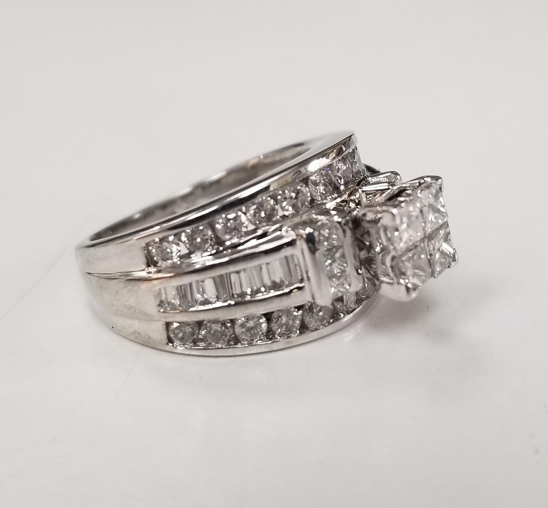 14k white gold invisible set diamond ring w/ princess, round and baguette cut diamonds, containing 50 diamonds weighing 1.20cts. diamond color 