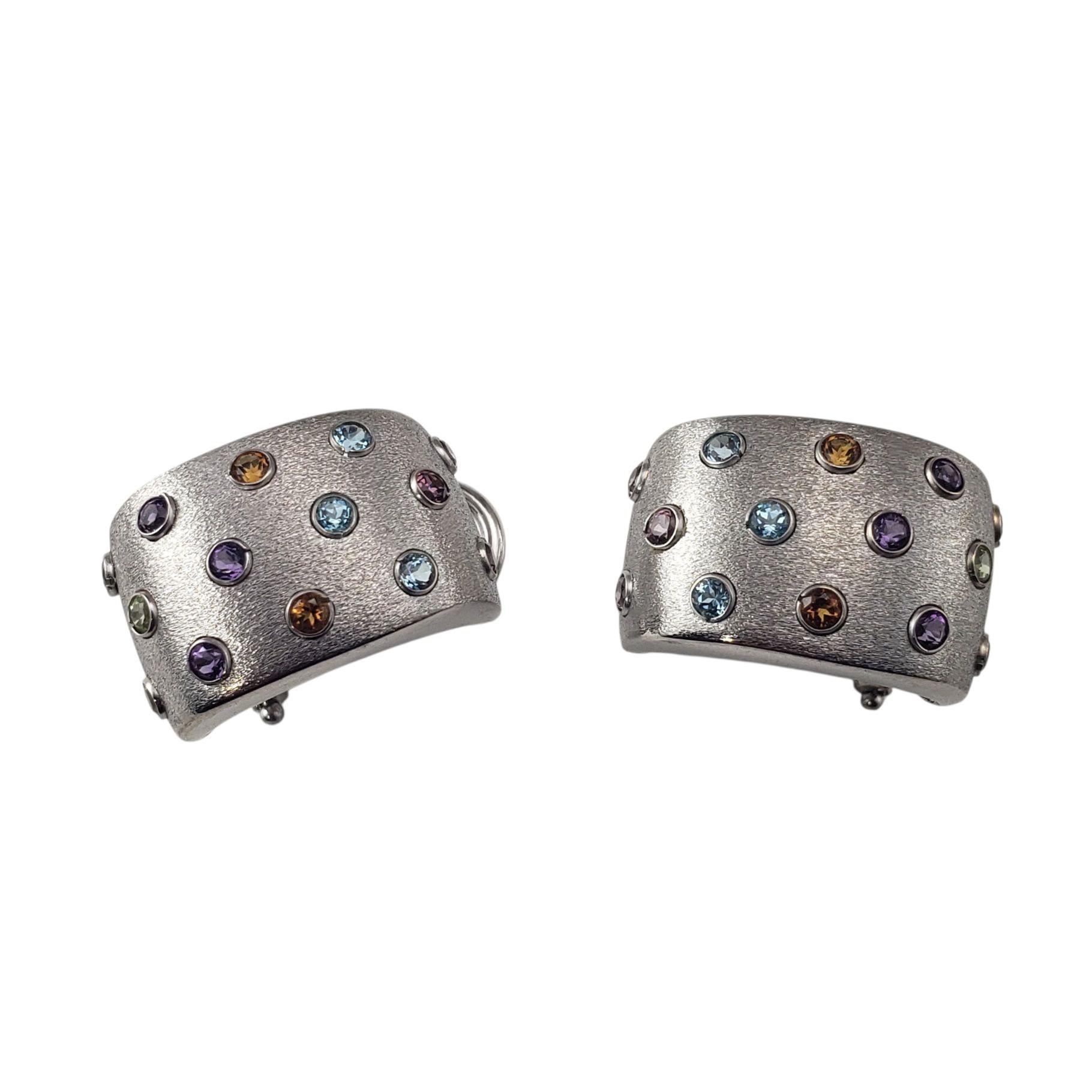 14K White Gold J Hoop Gemstone Earrings JAGi Certified-

Add a vibrant pop of color to your collection with these exquisite 14K white gold J-hoop earrings, featuring a scattered bezel-set design of scattered gemstones; six round rhodolite garnets,