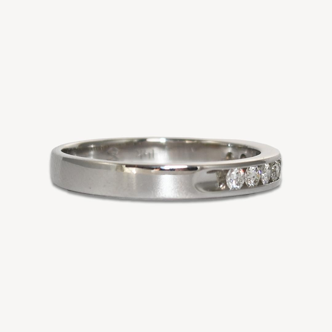 14k White Gold Diamond band in 14k white gold.
Stamped 14k and weighs 2.4 grams.
The diamonds are round brilliant cuts,.27 total carats, i color,
VS to Si clarity, very good to excellent cuts.
The ring measures 2.85mm wide.
Ring size is 6 and can be