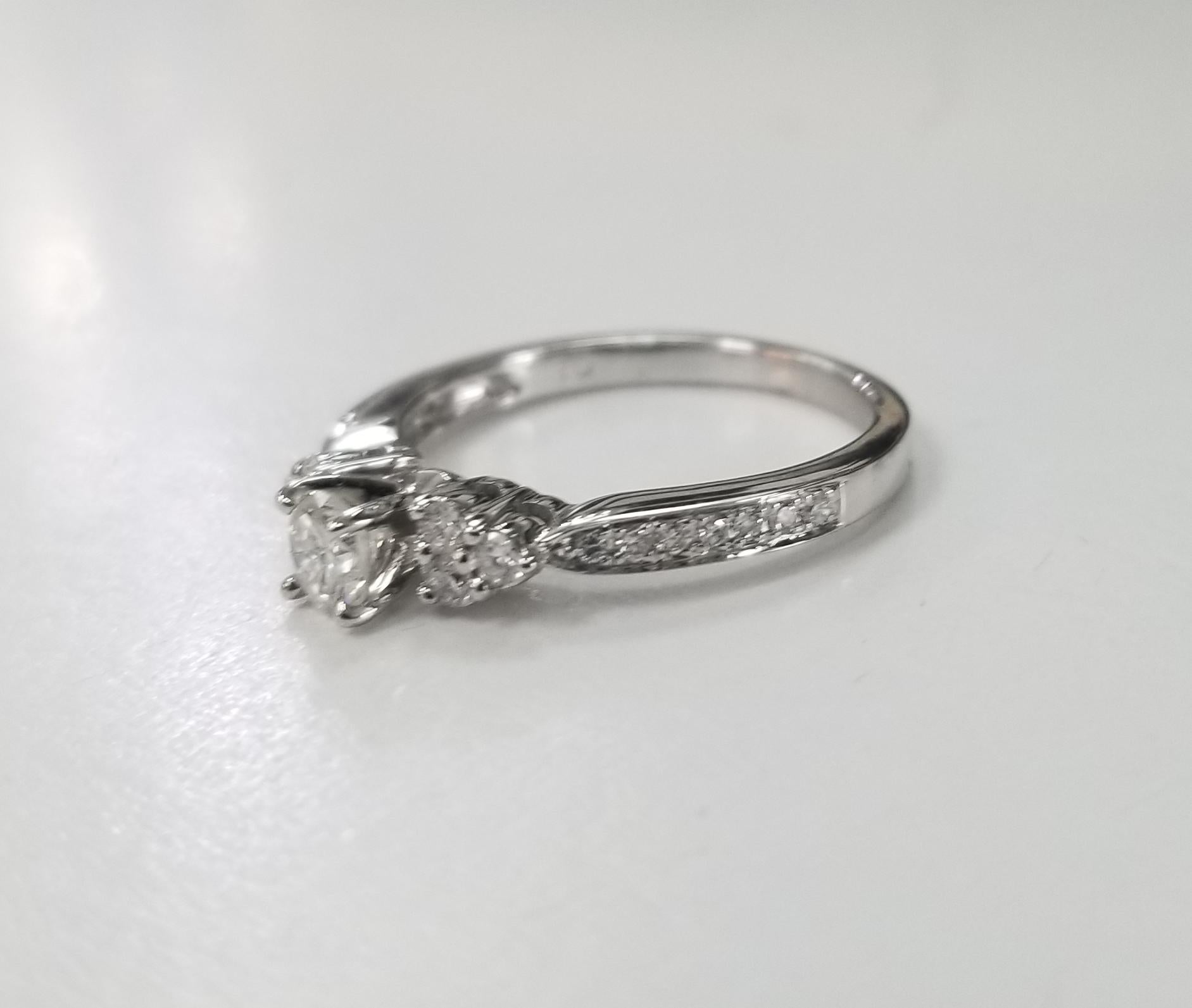 14k white gold ladies diamond engagement ring, containing 1 brilliant cut diamond; color 