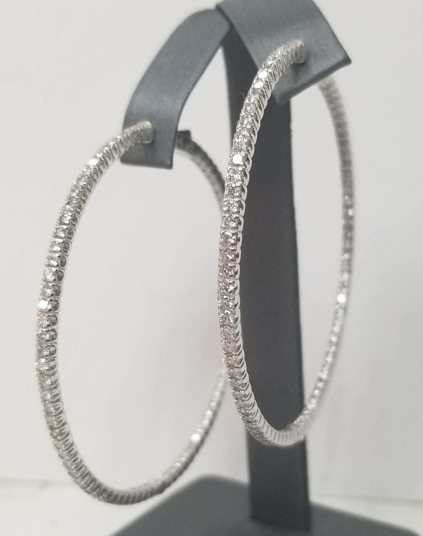About
14k white gold large 2 1/2 inch in diameter diamond hoop earrings
Specifications:
    main stone: 166 round Diamonds    
    carat total weight: 5.02CTW
    color: G
    clarity: VS
    metal: 14K WHITE GOLD
    type: HOOP EARRINGS
    weight:
