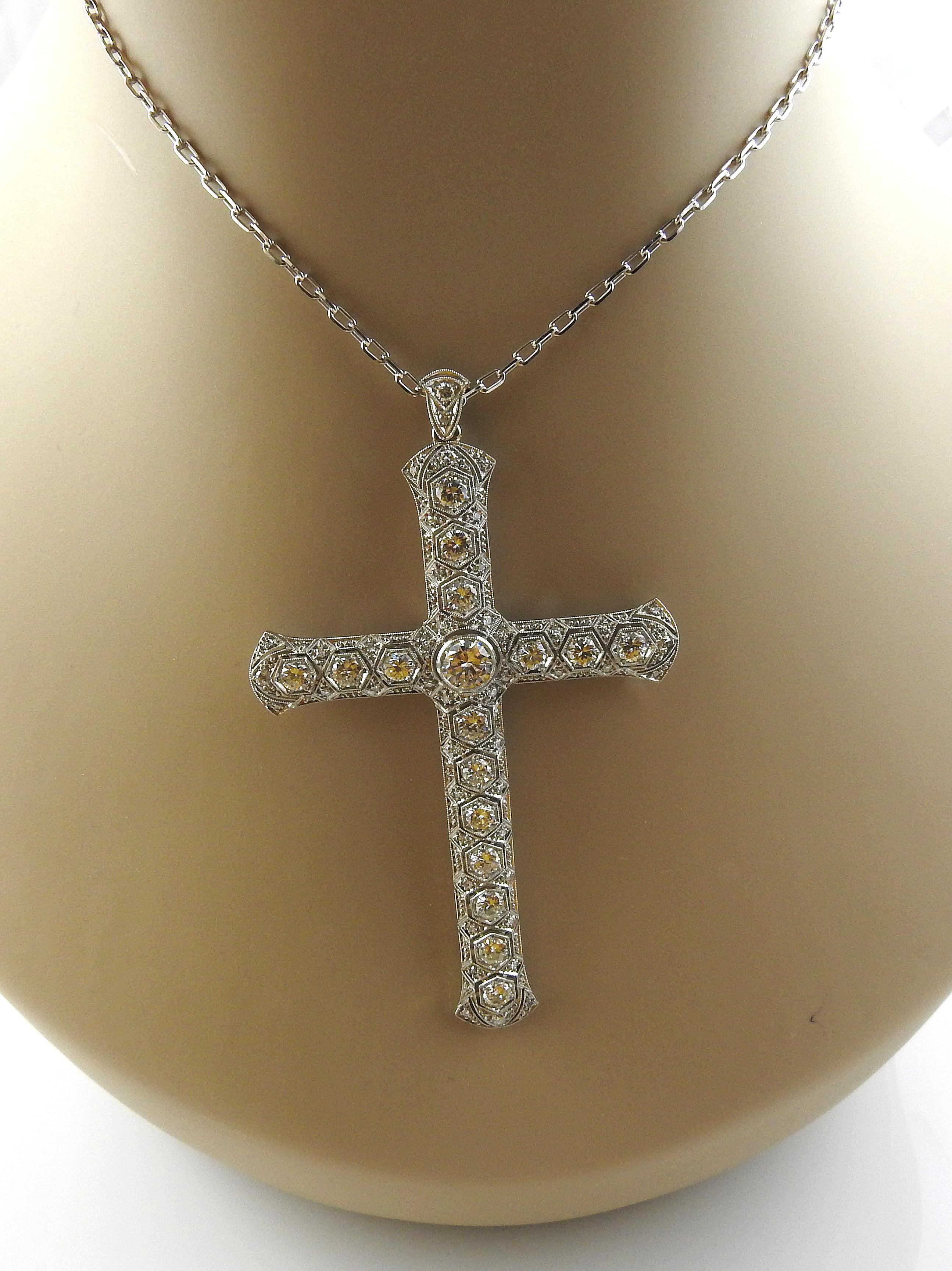 Vintage 14K White Gold Large Diamond Cross Pendant Necklace

This gorgeous statement piece is set with 62 round diamonds totally approx. 3.51 carats

Larger diamonds are round brilliant stones, with smaller single cut stones accenting the