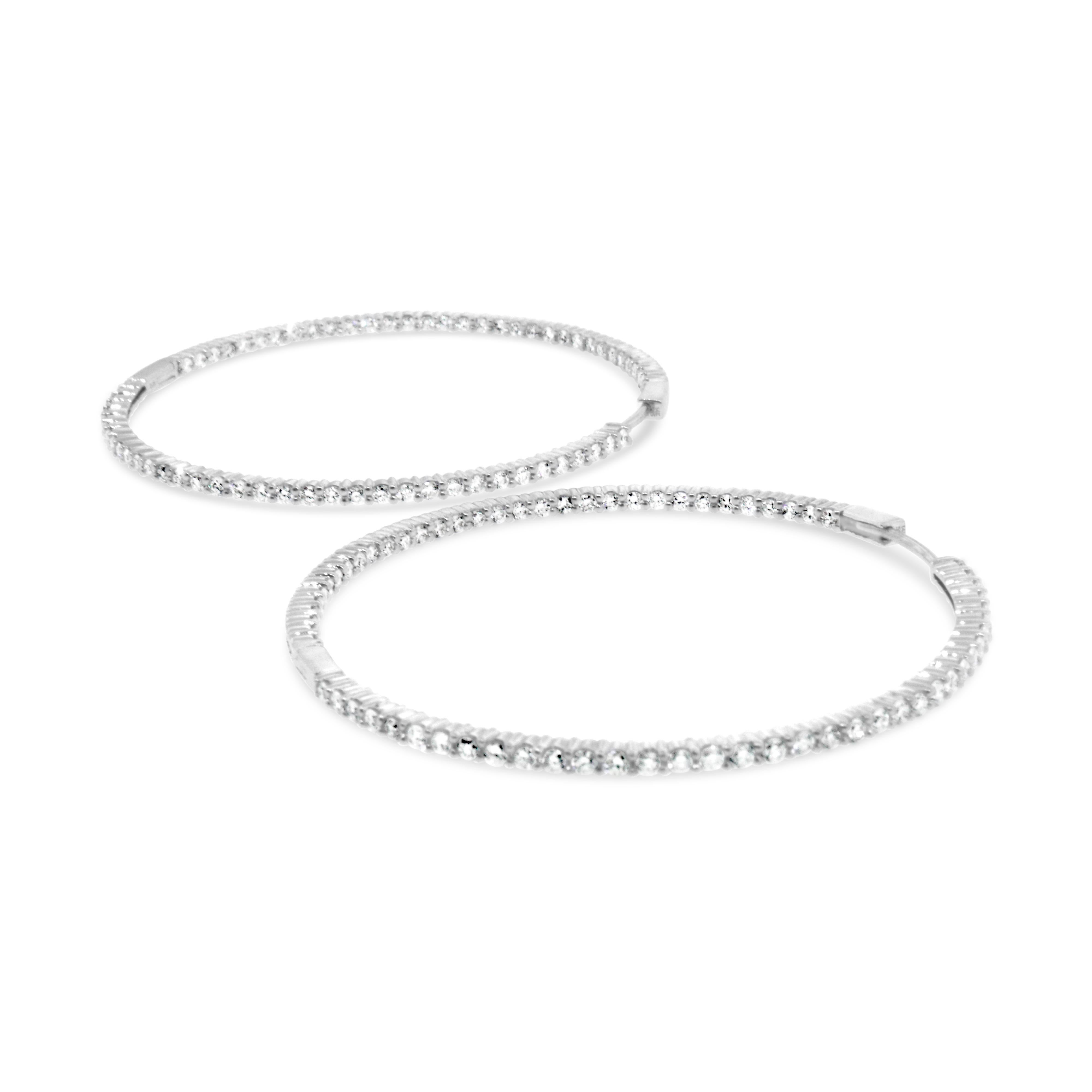 14 kt White Gold
Diamond: 3 ct twd (estimated)
Color: G-H
Clarity: SI1 - SI2
Diameter: 2 inches
Total Weight: 13 grams