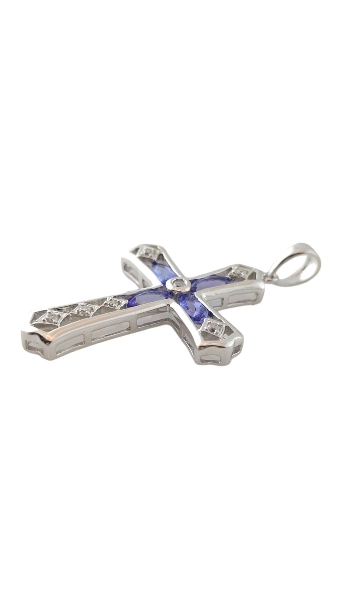 Vintage 14K White Gold Levian Tanzanite & Diamond Cross Pendant

Four gorgeous lab tested tanzanite stones and 6 sparkling round brilliant cut diamonds are paired together on this 14K white gold cross to make a beautiful pendant good for any chain