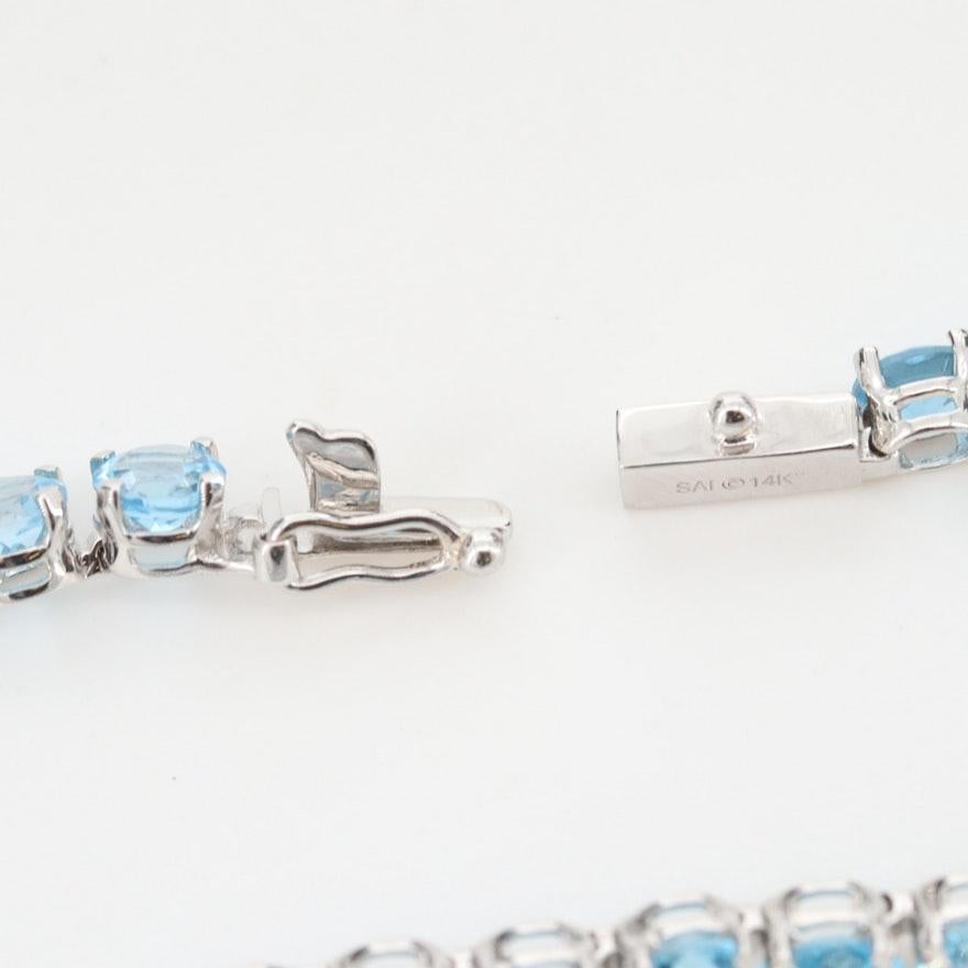 14 Karat White Gold Light Blue Topaz Tennis Line Bracelet 1