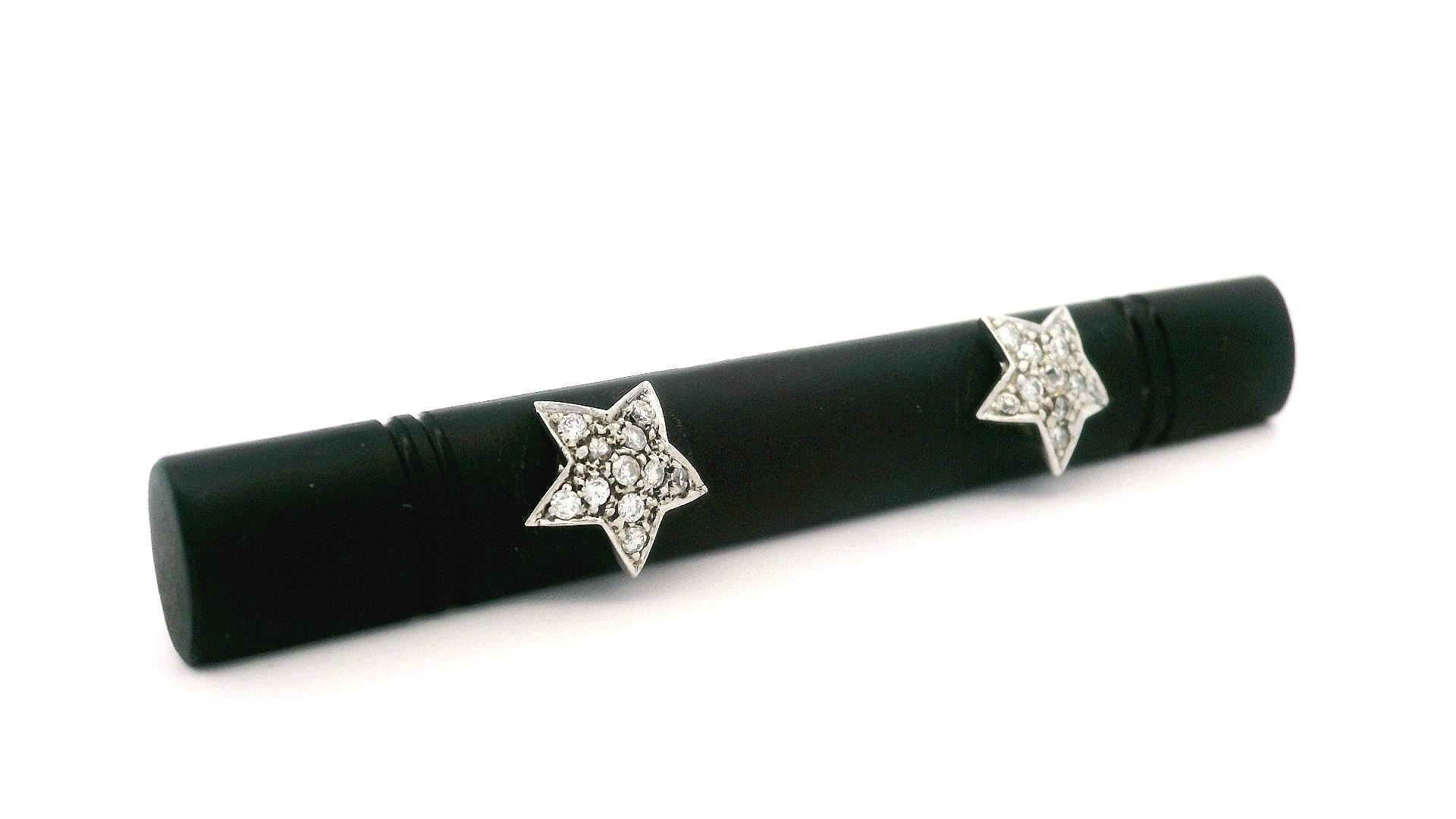 --Stone(s):--
(1) Natural Genuine Black Onyx - Long Carved & Pierced - Black Color - 60.2x8.3mm (approx.)
(23) Natural Genuine Diamonds - 22 Round Brilliant Cut & 1 Old Mine Cut - Pave Set - F-H Color - SI1/SI2 Clarity - 0.15ctw (approx.)

Material: