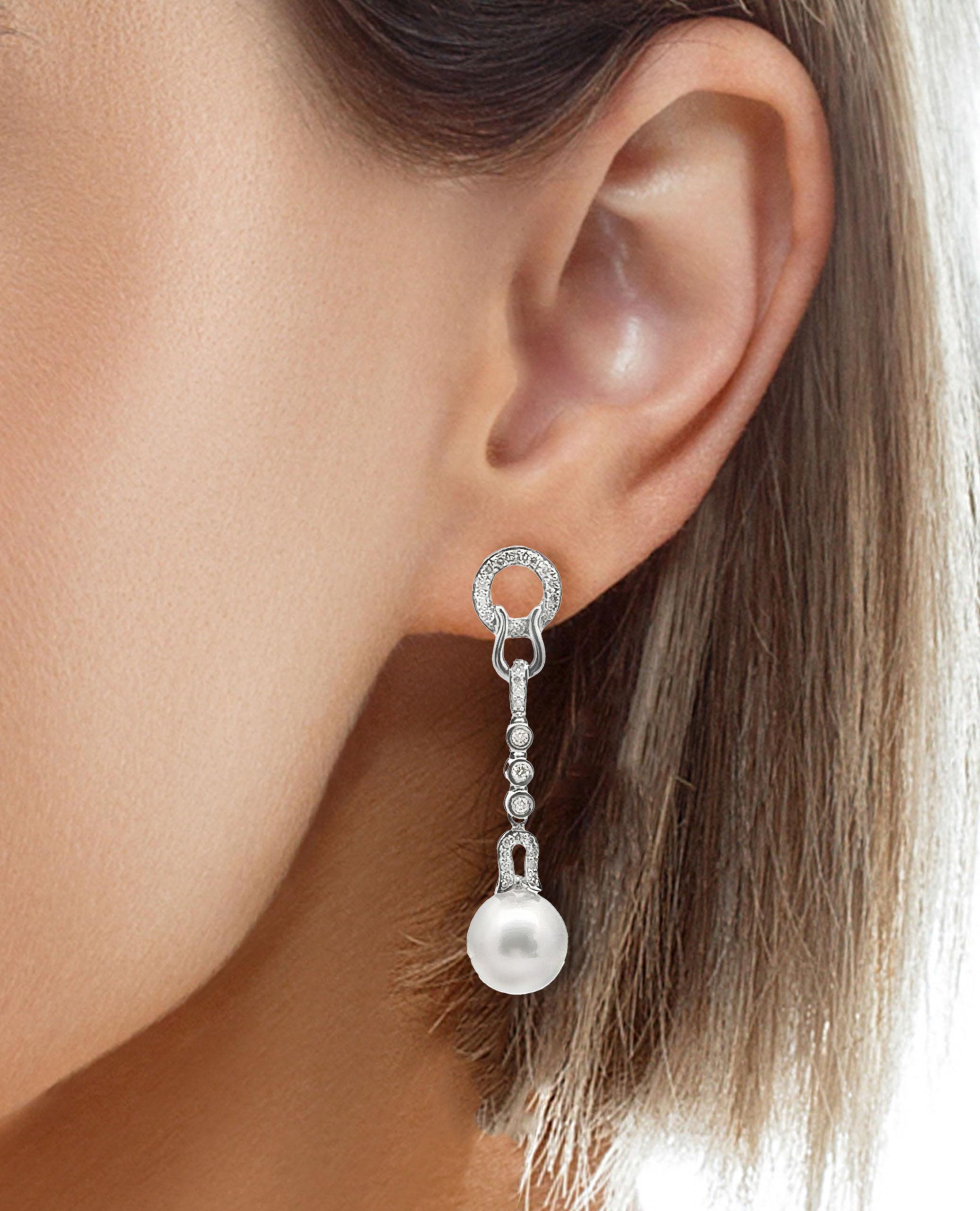 14K white gold dangle earrings with 0.40 carat diamonds and two 10mm South Sea pearls with silver undertones.

- Earring is 1.75 inches long
