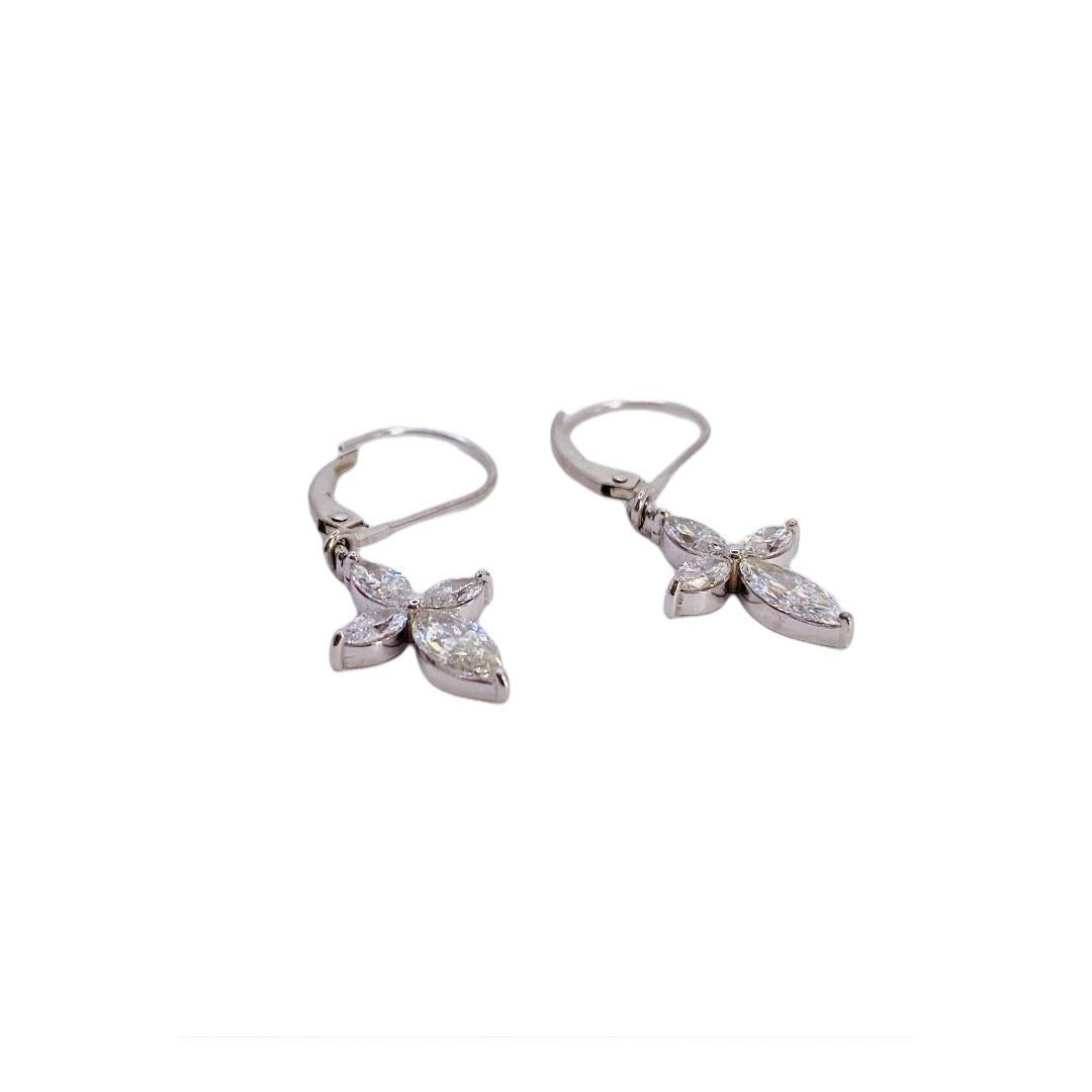 14 carat white gold 1.67ctw marquise diamond dangle earrings. Earring height 20 mm x width 10 mm. Secured with lever backs.
