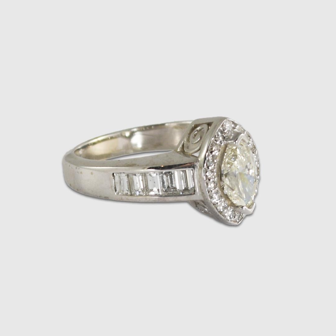 Ladies marquise diamond ring in 14k white gold setting.
The ring tests 57% gold with an XRF metals analyzer.
The center diamond is a .80 carat marquise shape, J- K color, and i1 clarity.
The two natural inclusions in the diamond are towards the