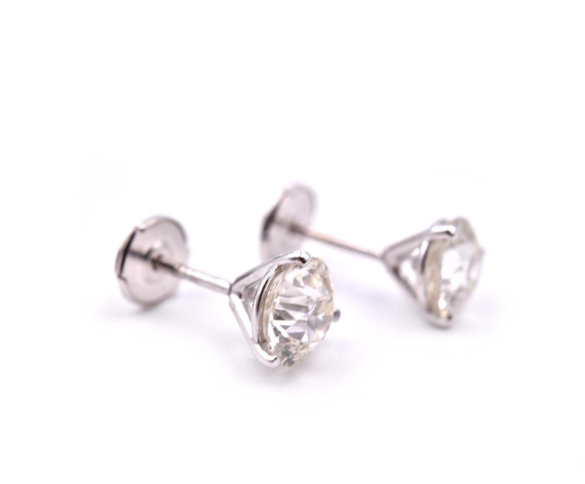 Designer: custom design
Material: 14k white gold
Diamonds: two round brilliant cut = 2.35cttw
Color: I-J
Clarity: SI2
Dimensions: earrings are approximately 6.45-6.72mm wide
Fastening: post with LaPousette backs
Weight: 1.62 grams 
