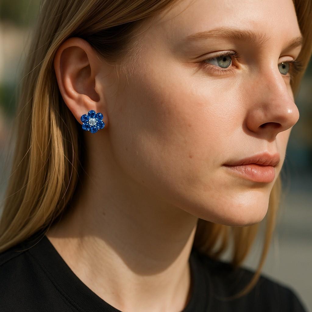 A Chic, Everyday Sparkle
Introduce a dash of refined color to your jewelry box with these 14K White Gold Mini Floral Stud Earrings, exquisitely set with 0.65 carats of round sapphires and 0.18 carats of diamonds. Designed in a subtle floral pattern,