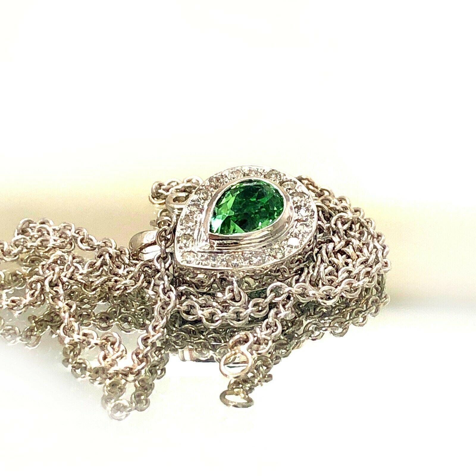  Beautiful 14k white gold mint tourmaline and diamond necklace. Centered with a pear shaped cut tourmaline surrounded by diamonds,this has 18 pieces of round cut diamonds in approximately 0.27 carat total weight and mint tourmaline in approximately