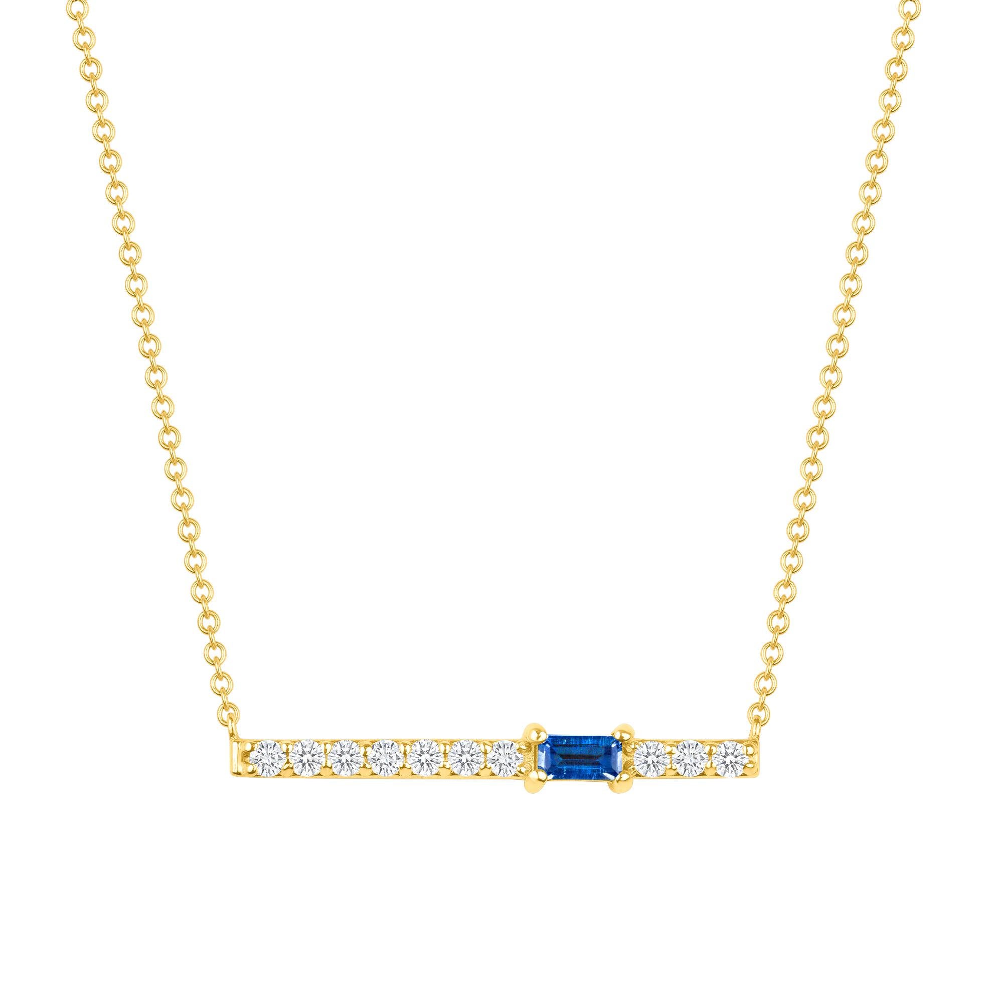 Crafted in 14K gold, round glistening diamonds enclose a baguette blue sapphire gemstone on this contemporary bar pendant. This stunning necklace is a modern piece that sits elegantly above the collarbone making it the perfect necklace for layering