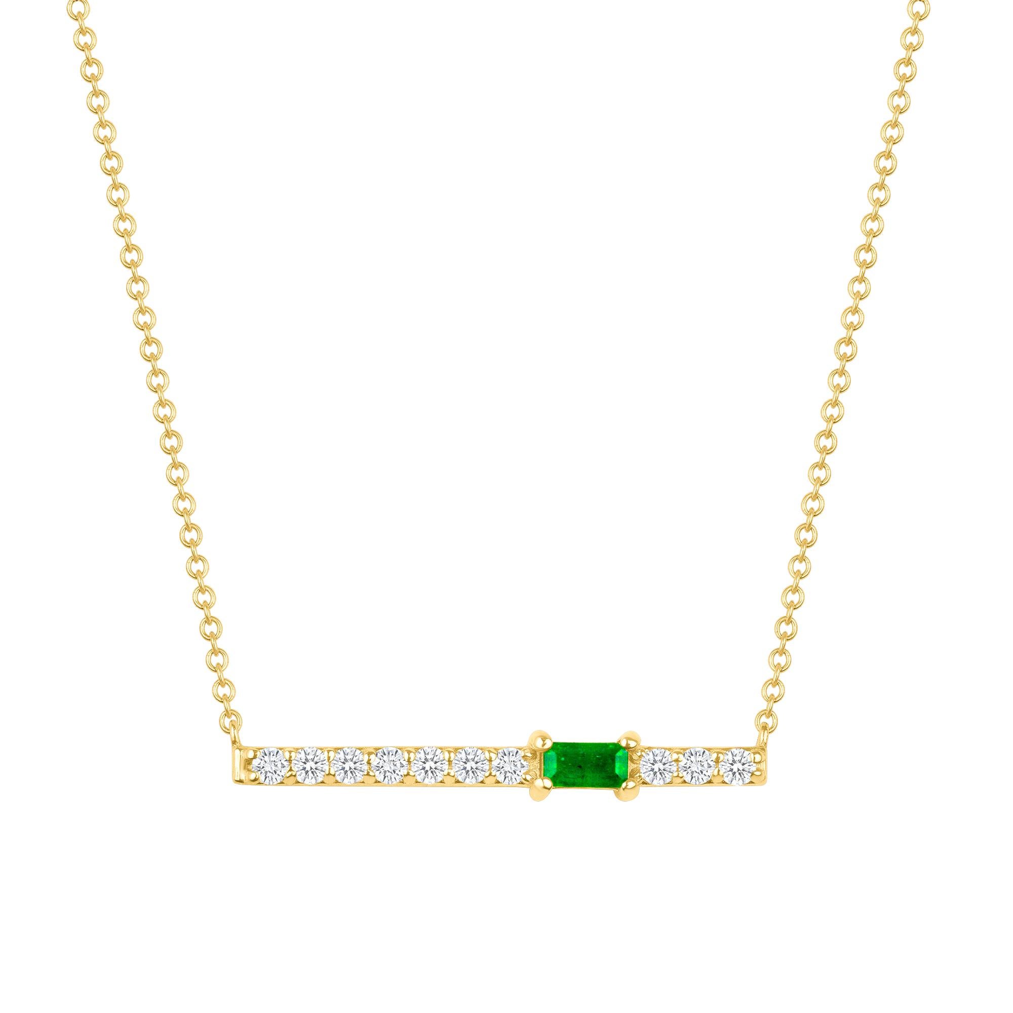 Crafted in 14K gold, round glistening diamonds enclose a baguette emerald stone on this contemporary bar pendant. This stunning necklace is a modern piece that sits elegantly above the collarbone making it the perfect necklace for layering or just