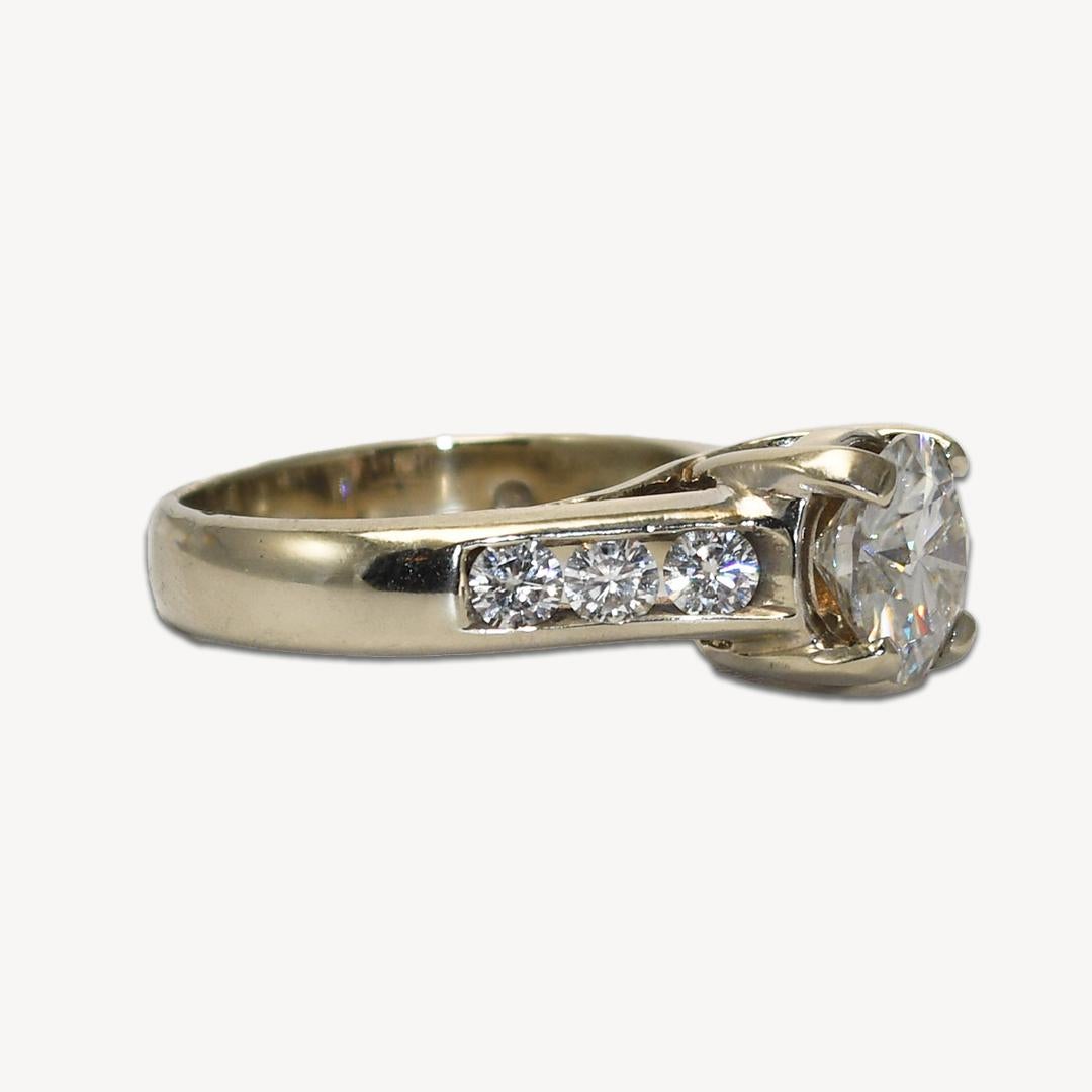 This is a 14K white gold Moissanite engagement & Wedding ring set
The accented solitaire engagement ring features a 1.70-carat 8-millimeter round brilliant cut moissanite mounted in a prong setting.
There are 6 accent stones on the engagement ring
