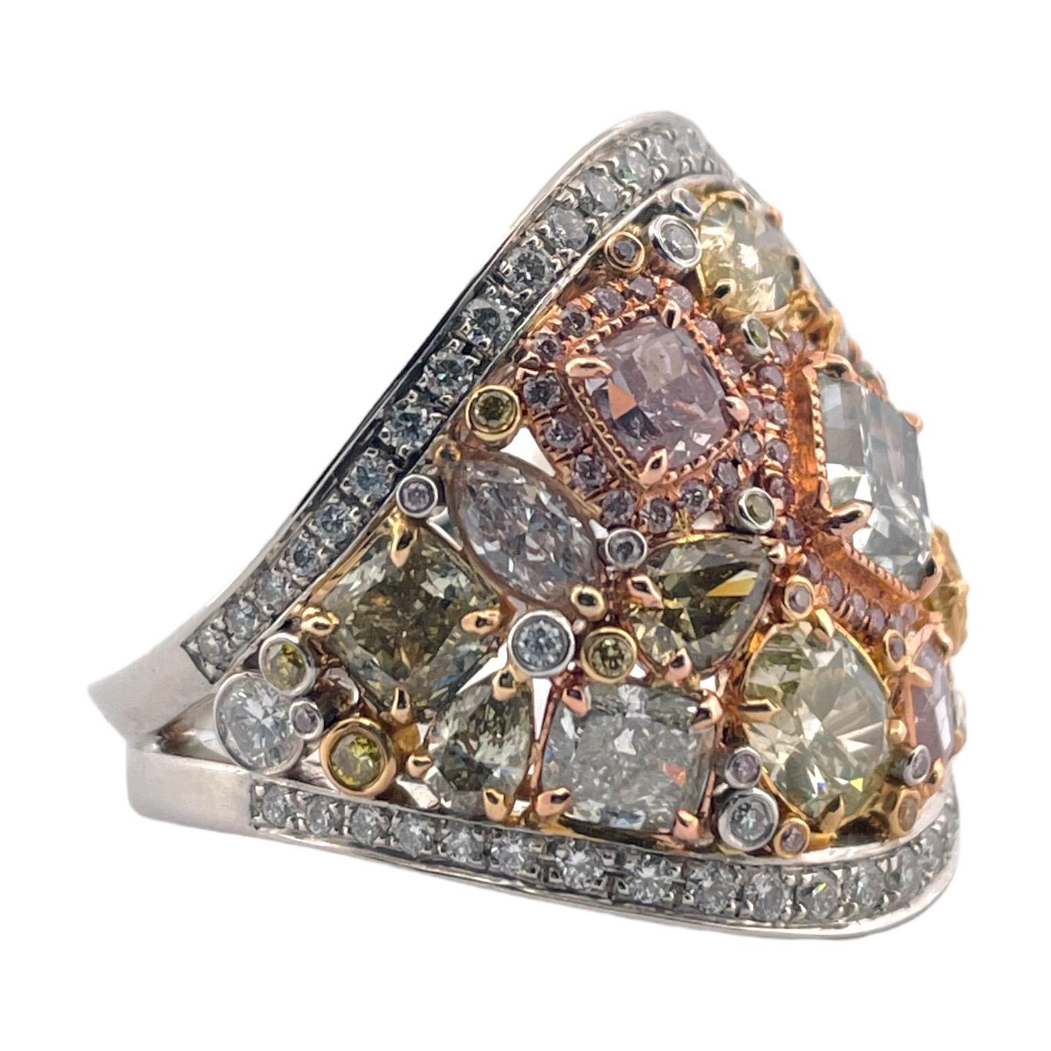 This exquisite ring is a masterful array of multi-colored diamonds, meticulously set in 14K white gold. Central to its design is a 1.17 CT light yellow-green VS1 diamond, encircled by an array of 0.53 CT oval fancy yellow, 0.40 CT cushion pink