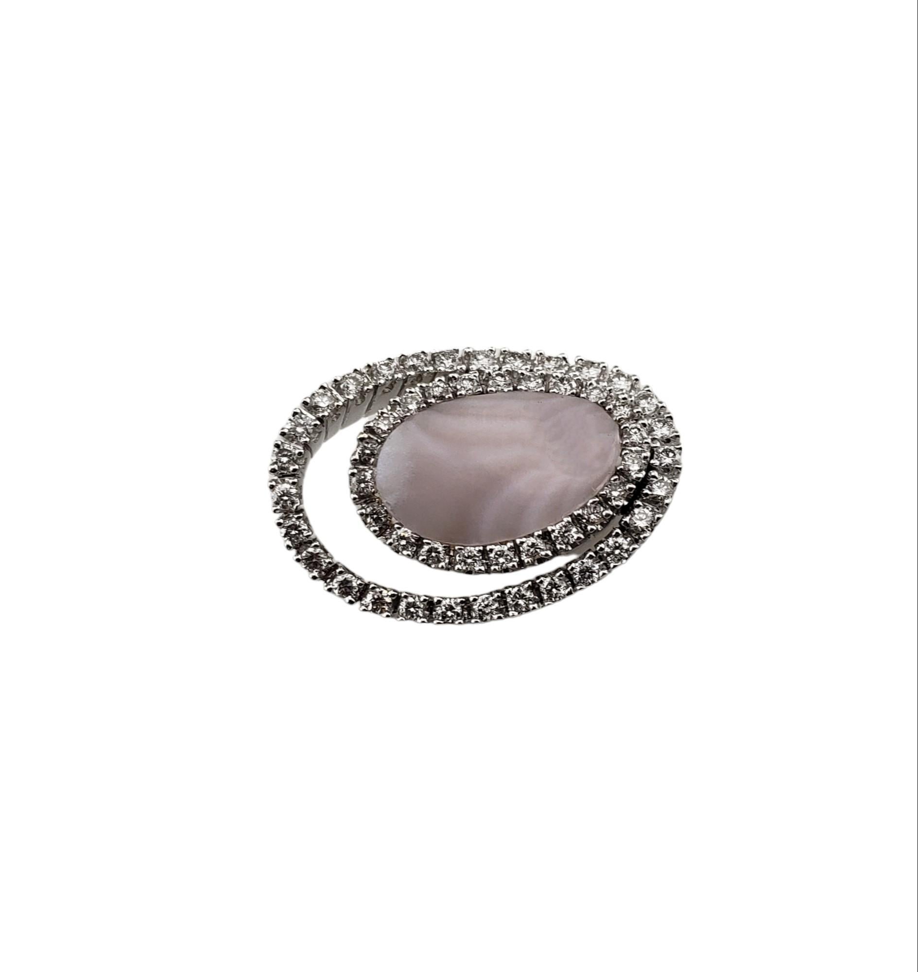 Vintage 14 Karat White Gold Mother of Pearl and Diamond Pendant JAGi Certified-

This stunning pendant features one oval light pink mother of pearl shell surrounded by 51 round brilliant cut diamonds set in classic 14K white gold.

Total diamond