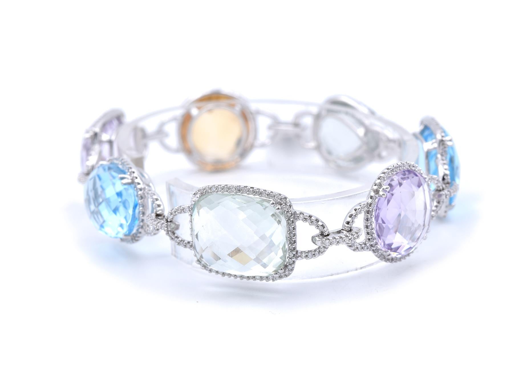 Designer: custom design
Material: 14k white gold
Gemstone: Amethyst, prasiolite, blue topaz, and citrine
Diamonds: 2.50cttw
Color: G
Clarity: SI1
Dimensions: bracelet will fit up to an 8-inch wrist and 16.60mm in width
Weight: 30.36 grams
