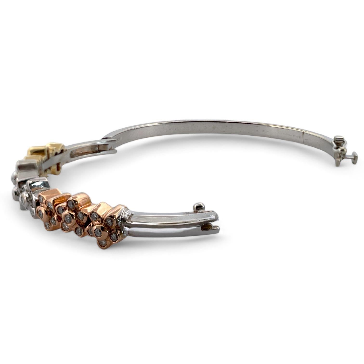 Aggiungi un tocco di eleganza ispirata alla natura alla tua collezione con questo splendido braccialetto in oro bianco 14K, dal peso di 28,17 grammi. Ornato da vivaci disegni floreali multicolore, questo braccialetto brilla con 1 carato di diamanti