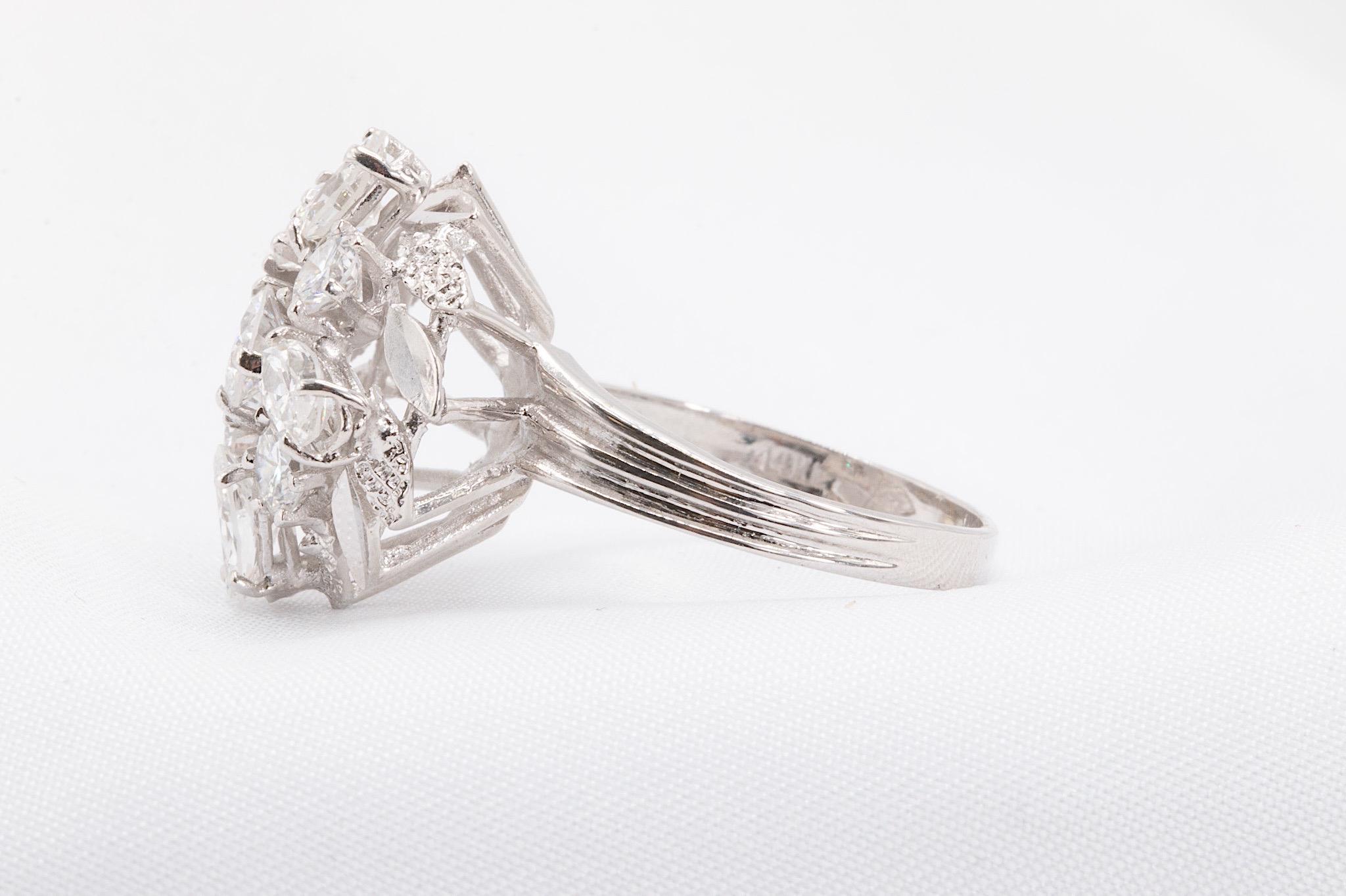 Vintage Three-Diamond Shape Cocktail Ring in 2 CTW  

This exquisite vintage cocktail ring showcases a unique and timeless design featuring three distinct diamond cuts: marquise, pear, and round. With approximately 2 CTW of exceptional diamonds