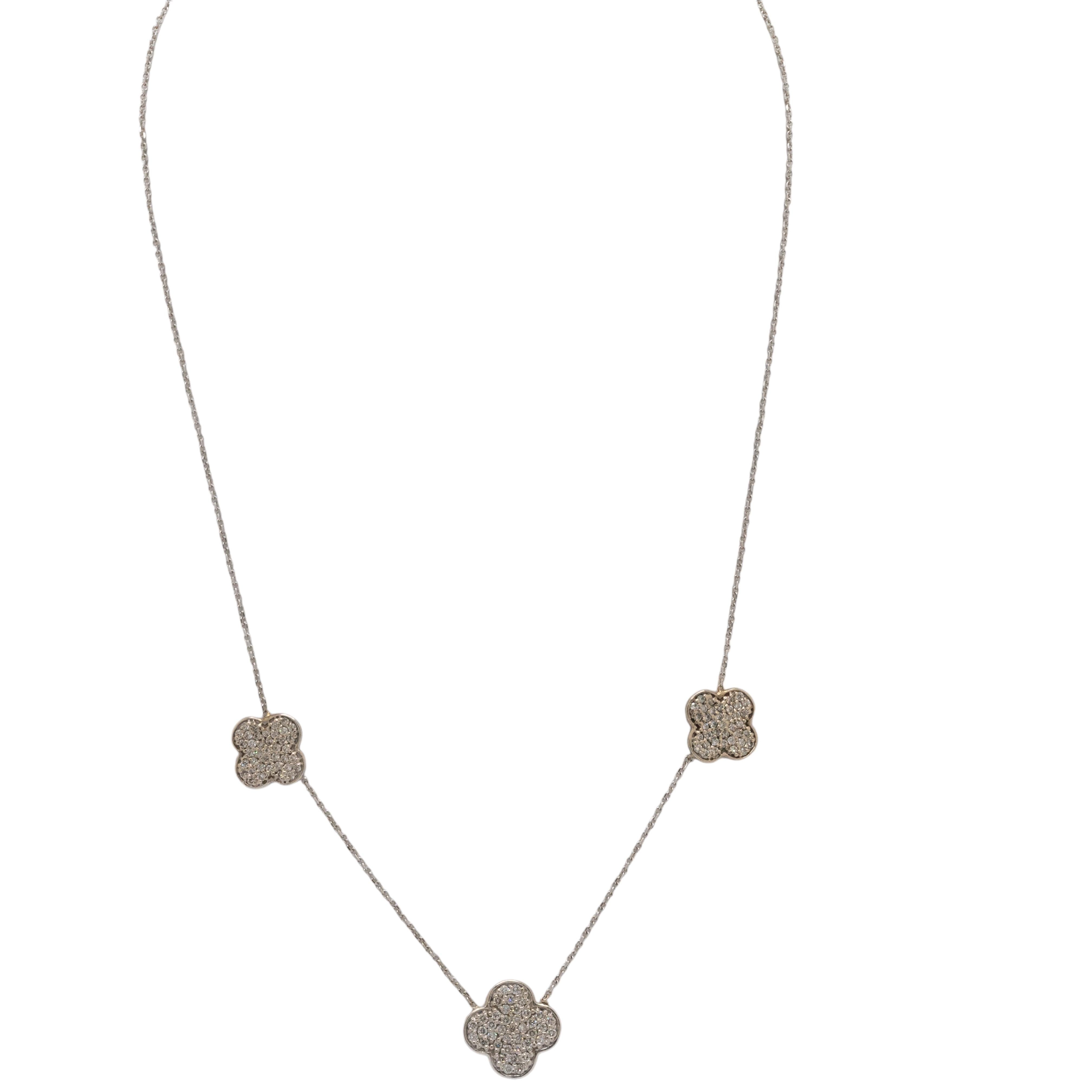 This elegant 14k White Gold Alhambra-shaped necklace is beautifully adorned with natural diamonds, creating a timeless and sophisticated piece. Measuring 17