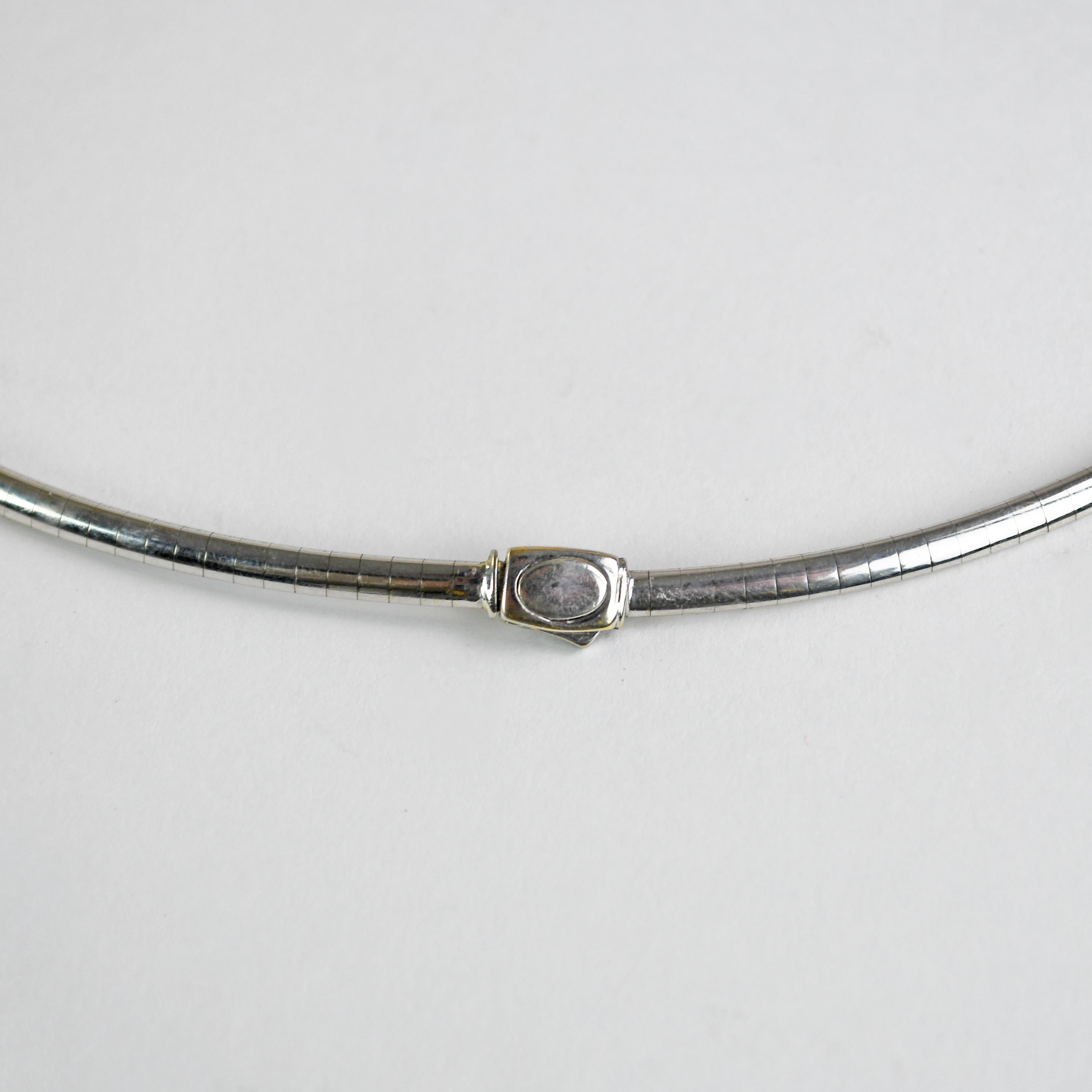 14k white gold omega link necklace.
Stamped 14k Italy and weighs 20.3 grams.
The necklace measures 17 1/2 inches long and 3.2mm wide.
Very good condition.