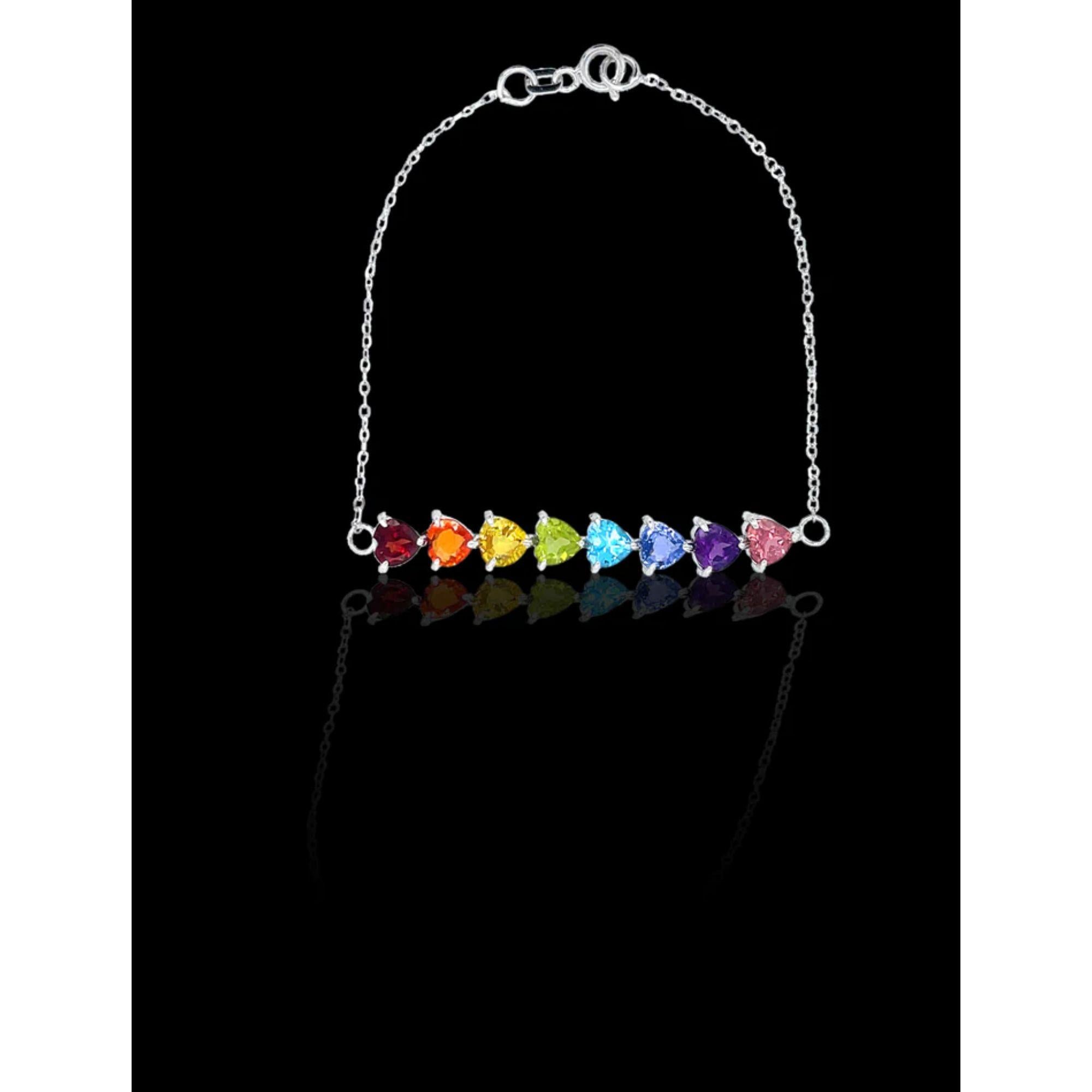 The full rainbow fantasy in the most unique and colorful bracelet to light up your life! 8 gems in the order of the rainbow connected with a thin roll chain make this bracelet. This dainty rainbow bracelet is like no other consists of heart settings