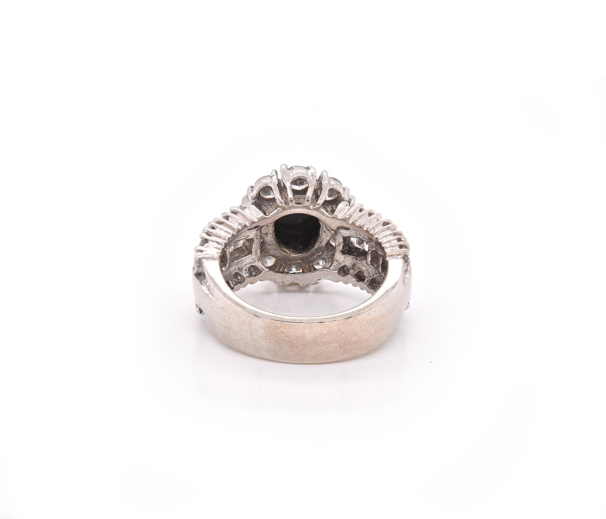 Round Cut 14 Karat White Gold Onyx and Diamond Halo Ring For Sale