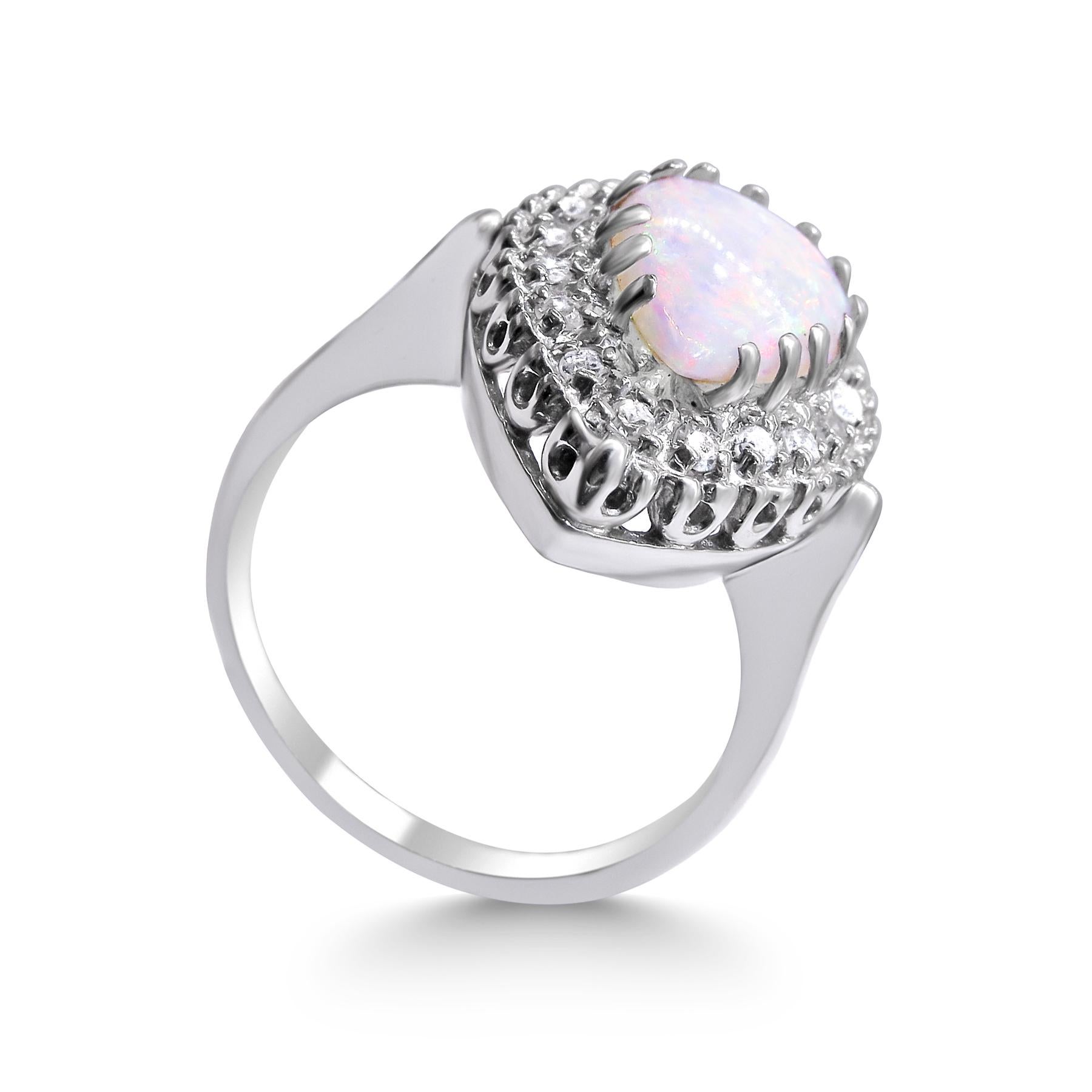 14k White gold
Weight= 5 gr 
Size= 7 (We offer complementary resizing upon request ) 
Diamond= 0.15 ct total 
Opal= 11mm x 8mm 