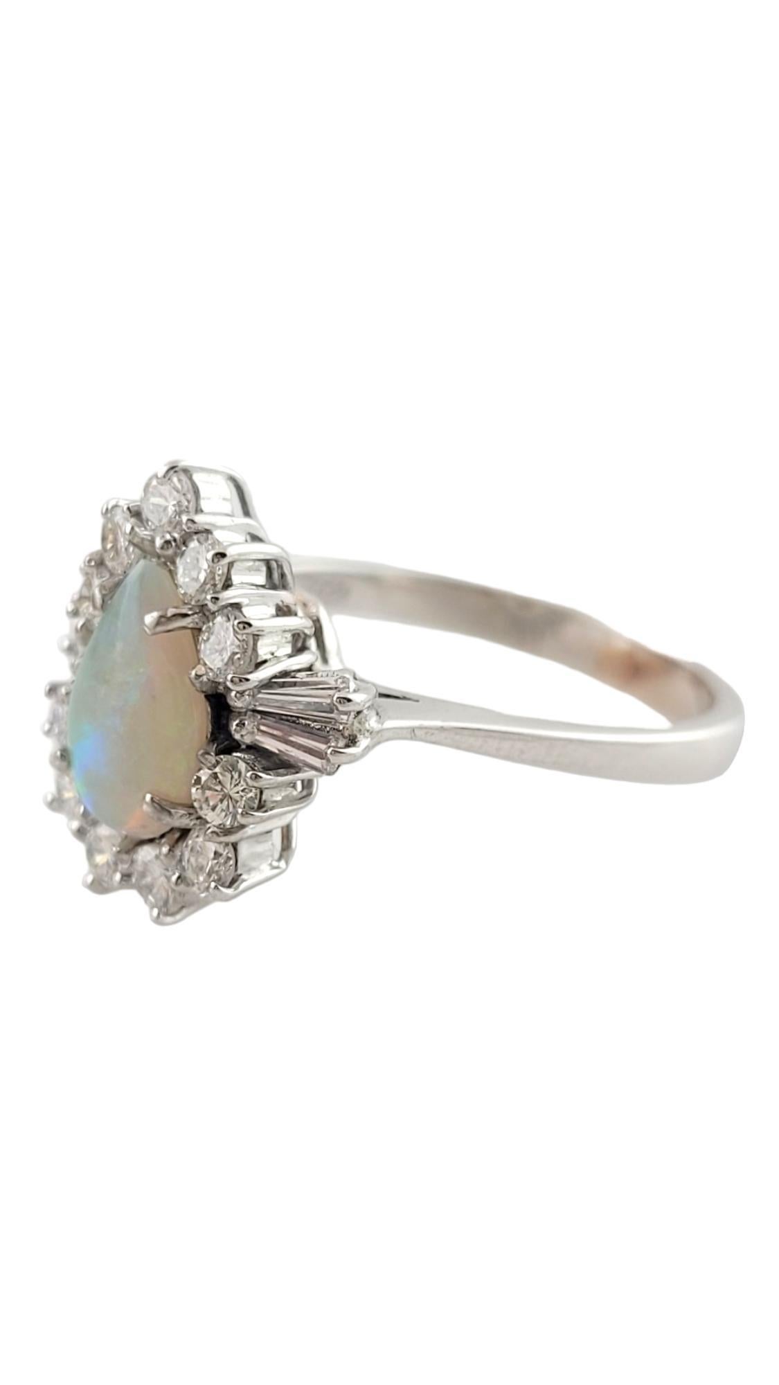 Vintage 14K White Gold Opal Diamond Ring size 7.25

This gorgeous 14K white gold ring features a breathtaking pear shaped opal stone in the center, surrounded by 11 round brilliant cut diamonds and 4 beautiful baguette cut diamonds!

Approximate