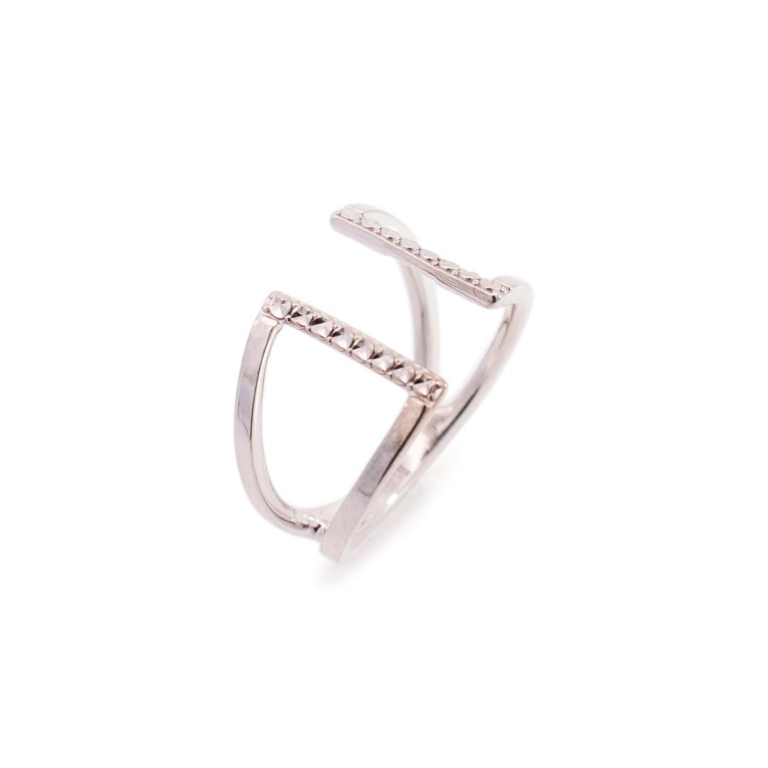 Gender: Unisex

Material: 14K white gold

Size: 6.5

Total Weight: 3.62 grams

Thickness: 12.60mm

Shank Type: Split

Polished rhodium plated 14k white gold cocktail ring. Engraved with 