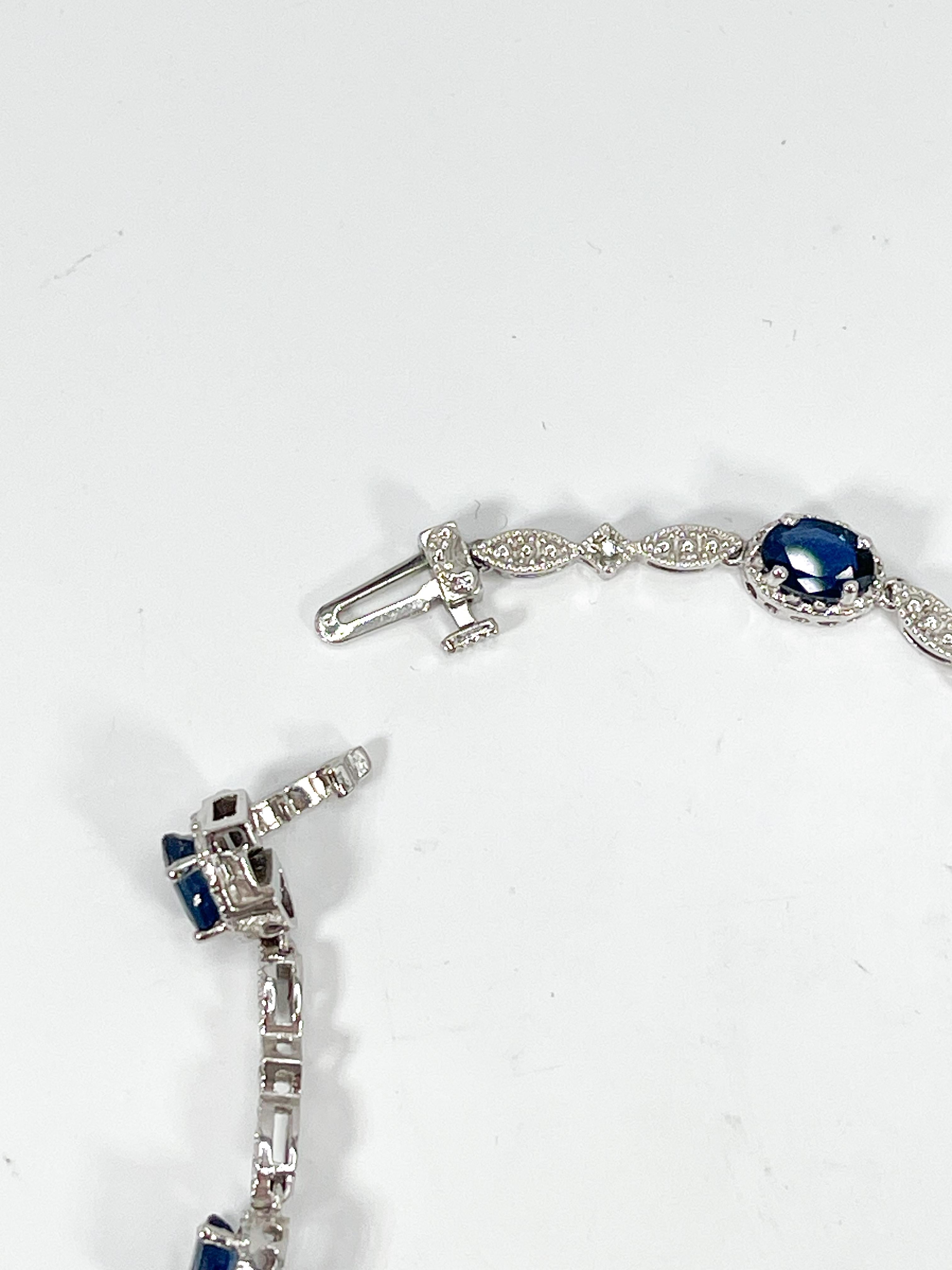 14K White Gold Oval 5.20 CTW Sapphire and Diamond Line Bracelet  In Excellent Condition For Sale In Stuart, FL