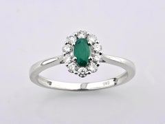 14K White Gold Oval Emerald and Round Diamond Halo Ring