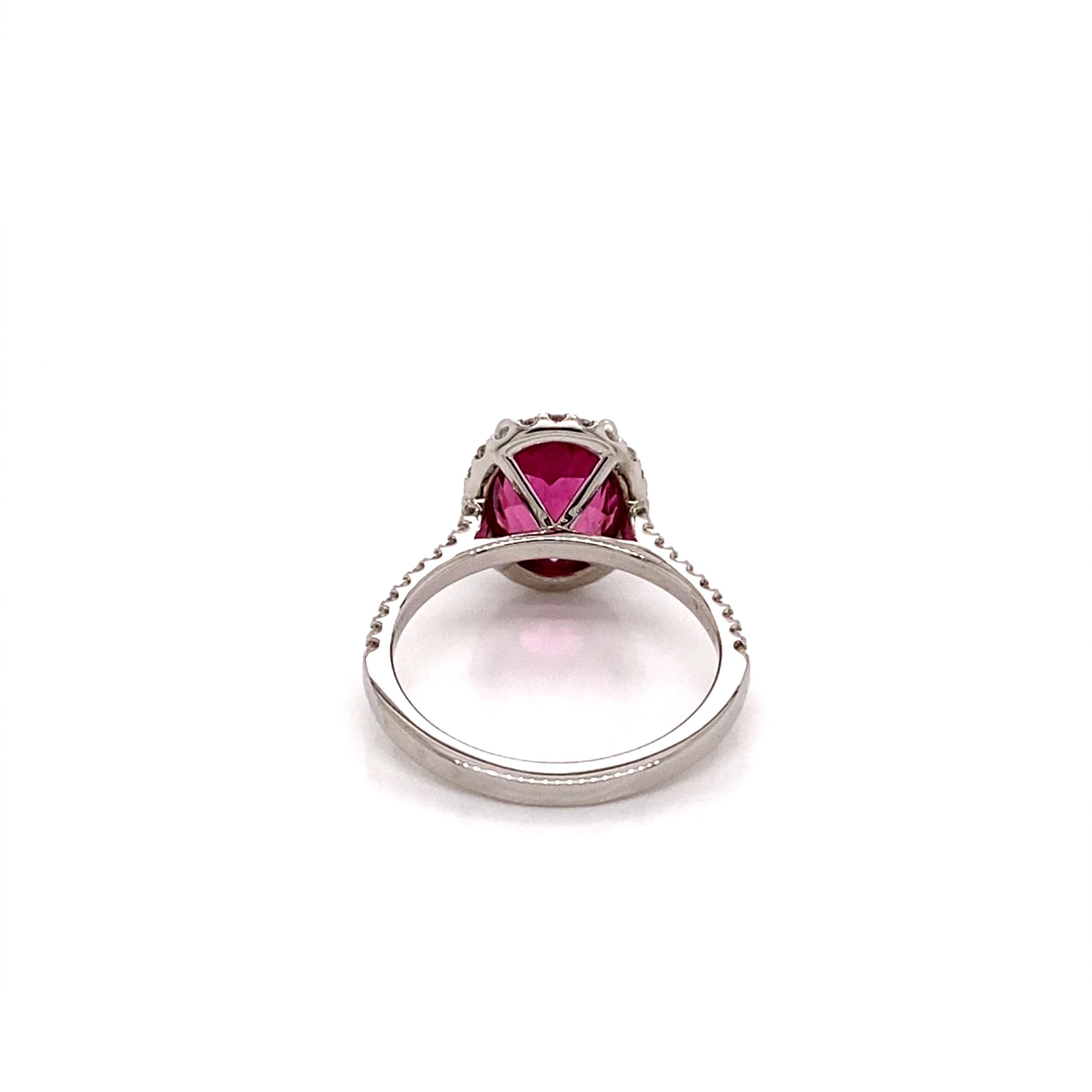 Women's 14 Karat White Gold Oval Pink Tourmaline Diamond Halo Ring For Sale