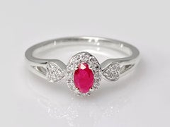 14K White Gold Oval Ruby Halo Ring with Diamond Heart Accents