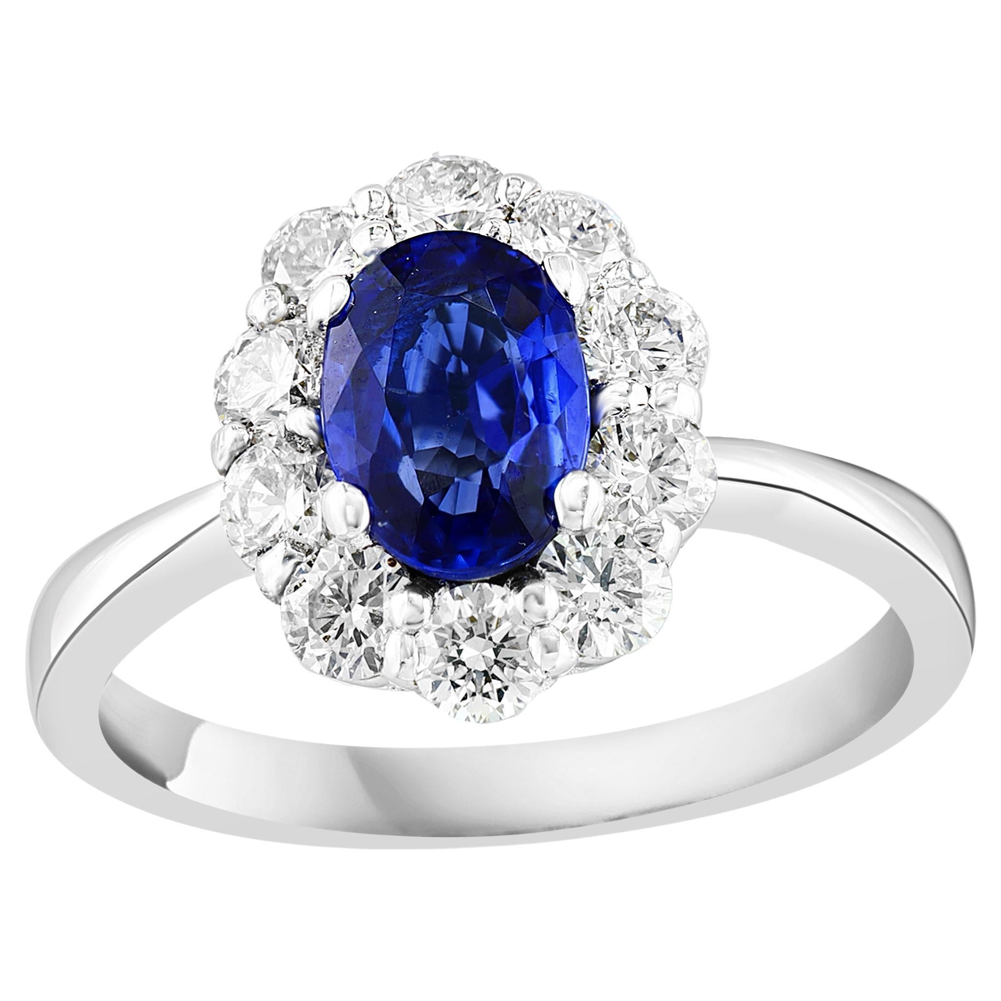 14k white gold Oval Sapphire and diamond halo engagement ring
