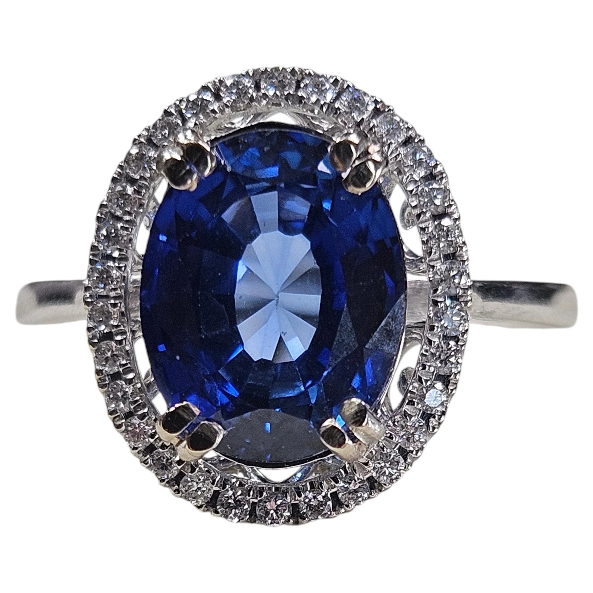 14k White Gold 3.65ct. Oval Sapphire 0.15ct Diamond Halo Ring (3.80Ctw)
