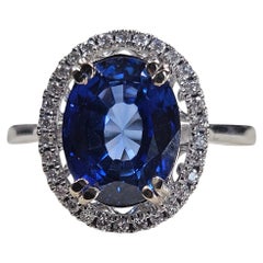 14k White Gold 3.65ct. Oval Sapphire 0.15ct Diamond Halo Ring (3.80Ctw)