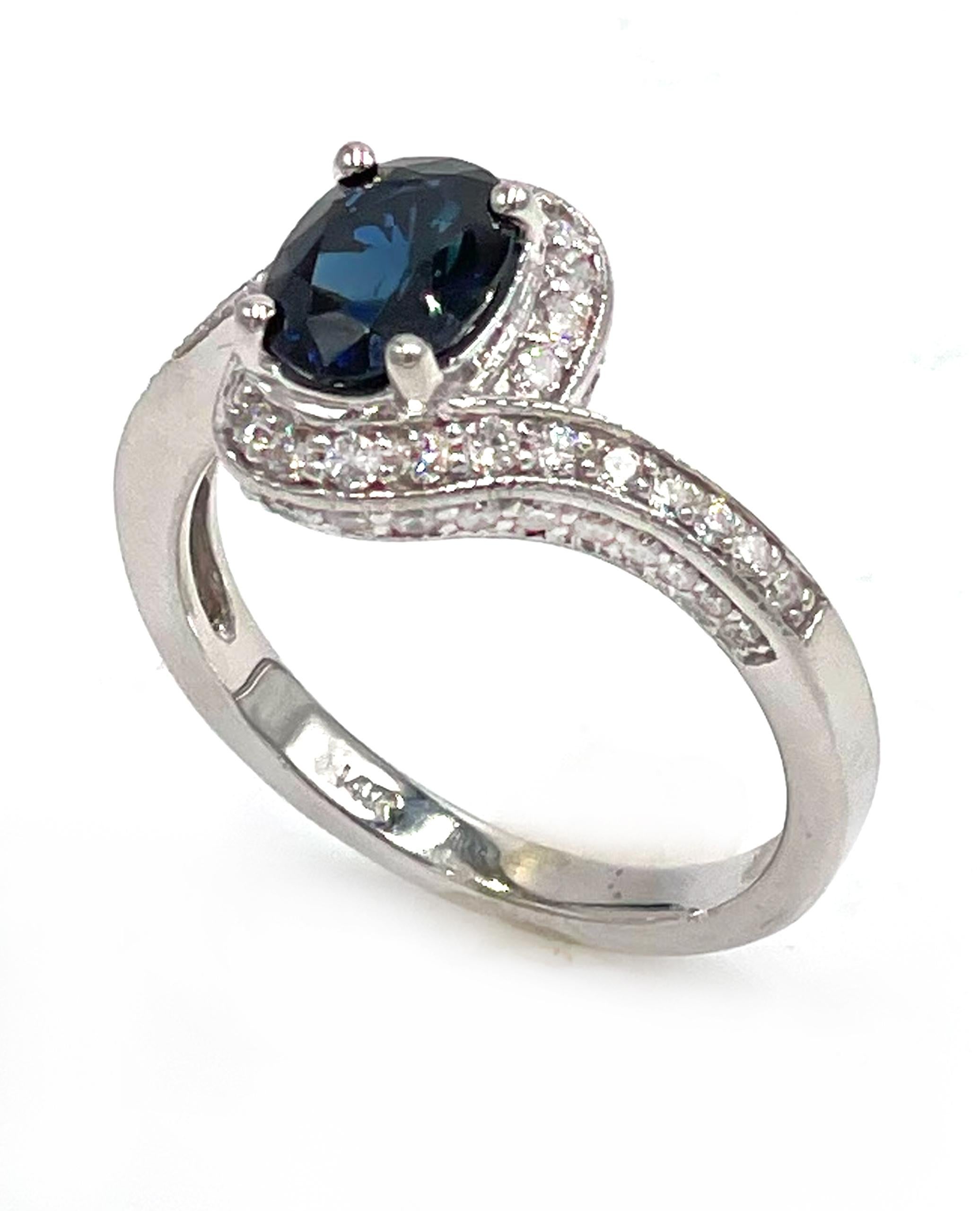 Contemporary 14K White Gold Oval Sapphire Halo Ring with Diamonds For Sale