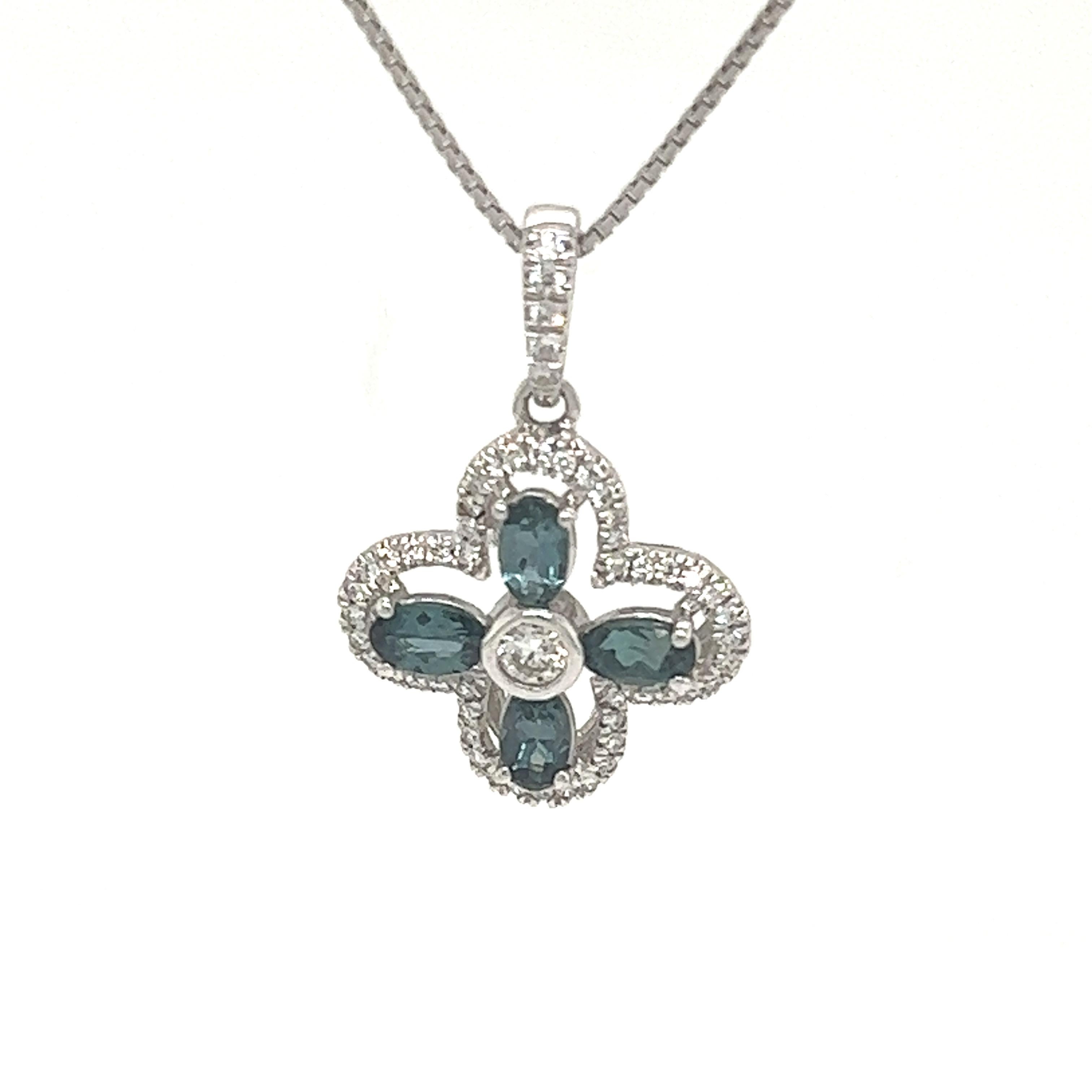 This is an exceptional natural oval-shaped alexandrite and diamond pendant set in solid 14K white gold. The fancy 6X5MM Alexandrite has an excellent green color and is surrounded by a halo of round-cut white diamonds. The pendant is stamped 14K and