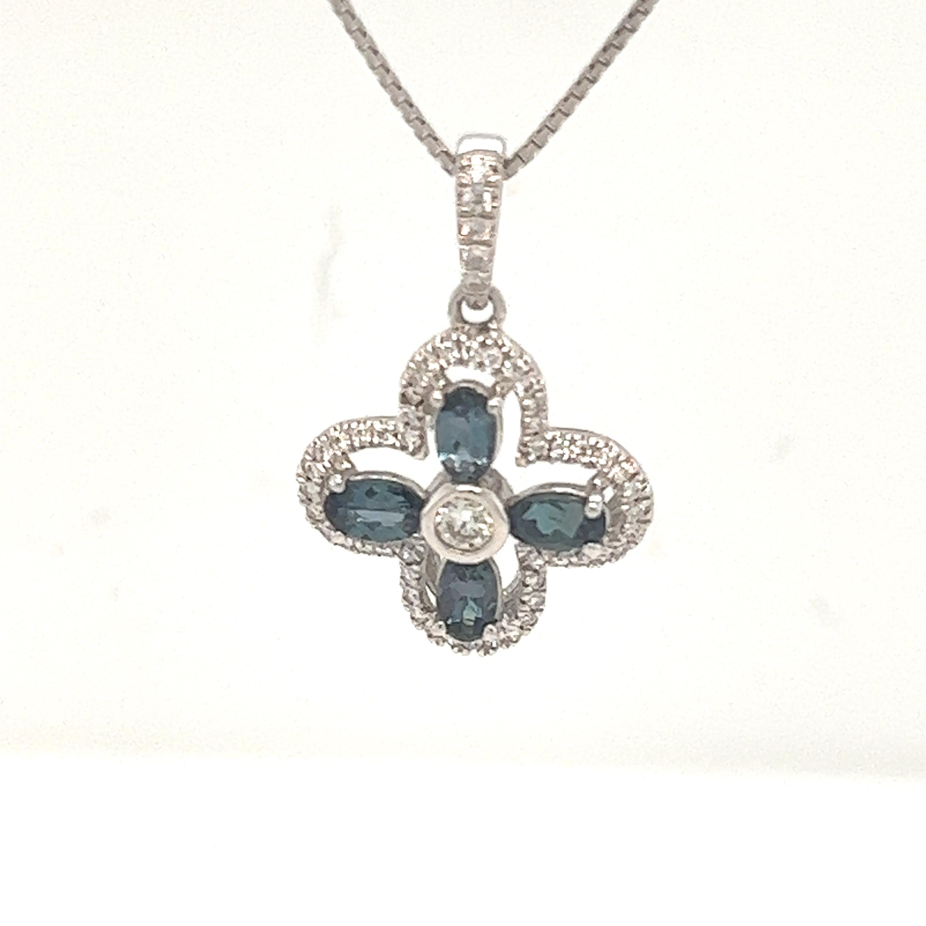 This is an exceptional natural oval-shaped alexandrite and diamond pendant set in solid 14K white gold. The fancy 5x3MM Alexandrite has an excellent green color and is surrounded by a halo of round-cut white diamonds. The pendant is stamped 14K and