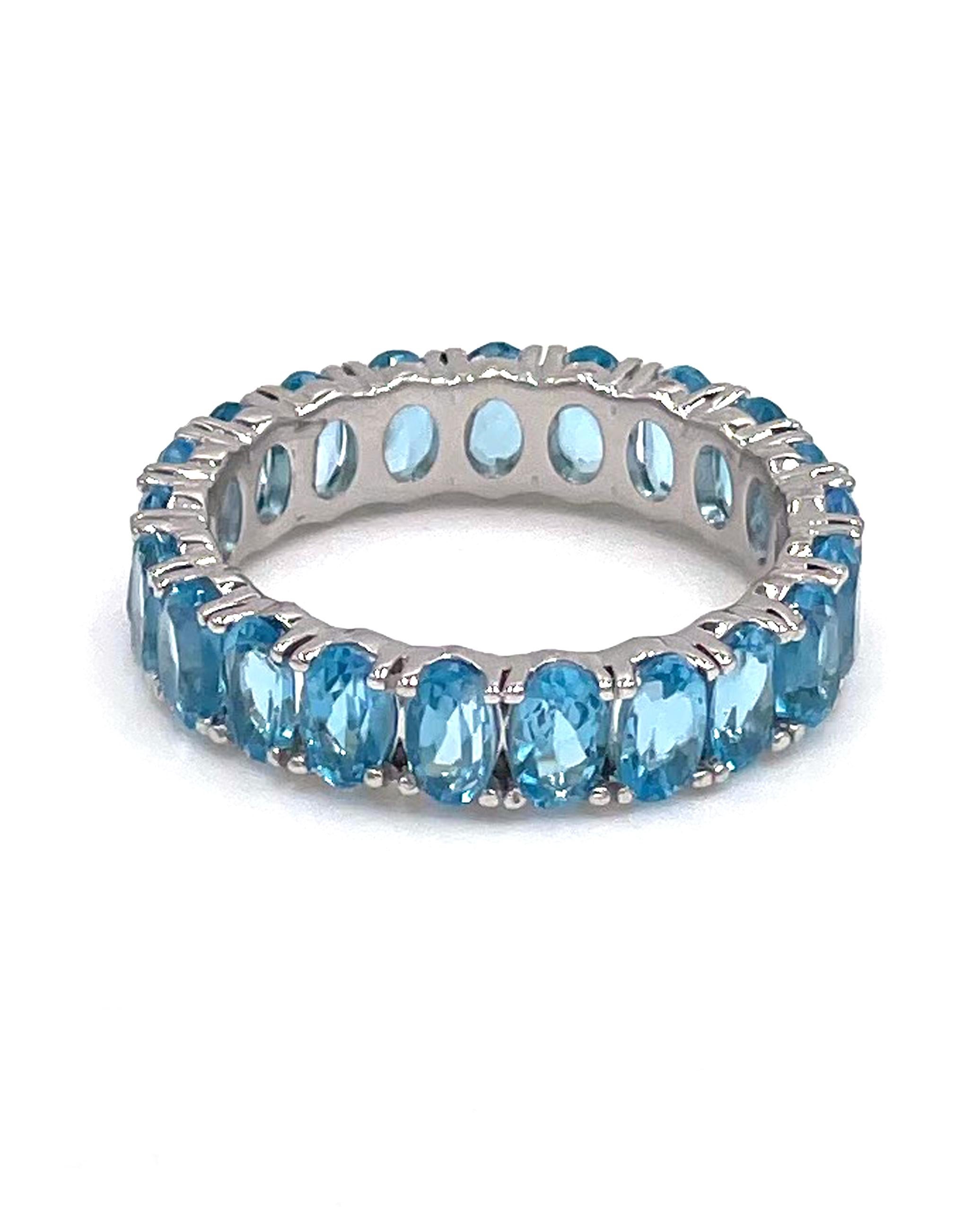 14K white gold eternity ring with 21 oval shaped sky blue topaz 6.64 carats total weight.

* Finger size 8
* 5.10mm wide