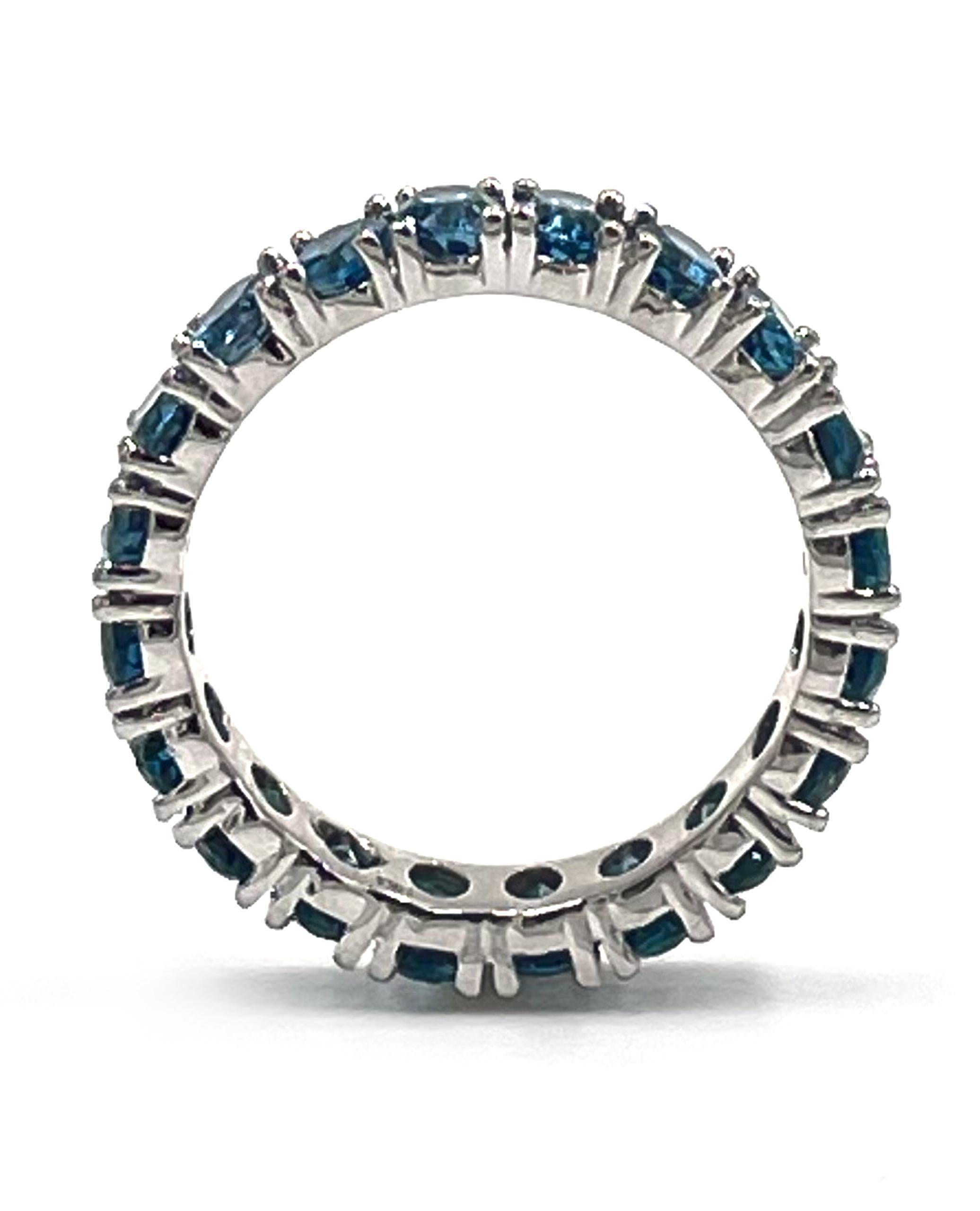 Contemporary 14K White Gold Oval Shape London Blue Topaz Eternity Ring For Sale