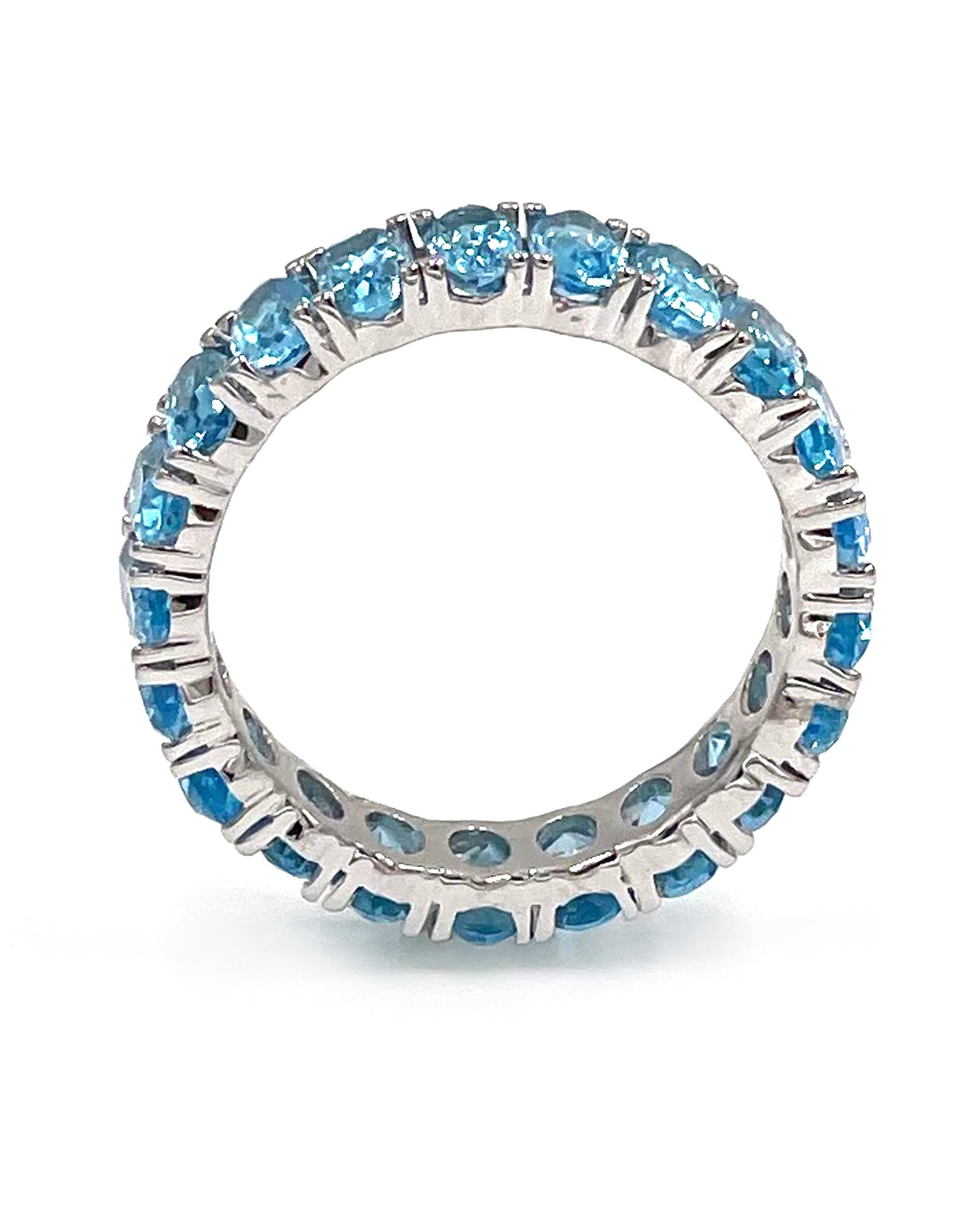 Contemporary 14K White Gold Oval Shape Sky Blue Topaz Eternity Ring - 5.51 carats For Sale