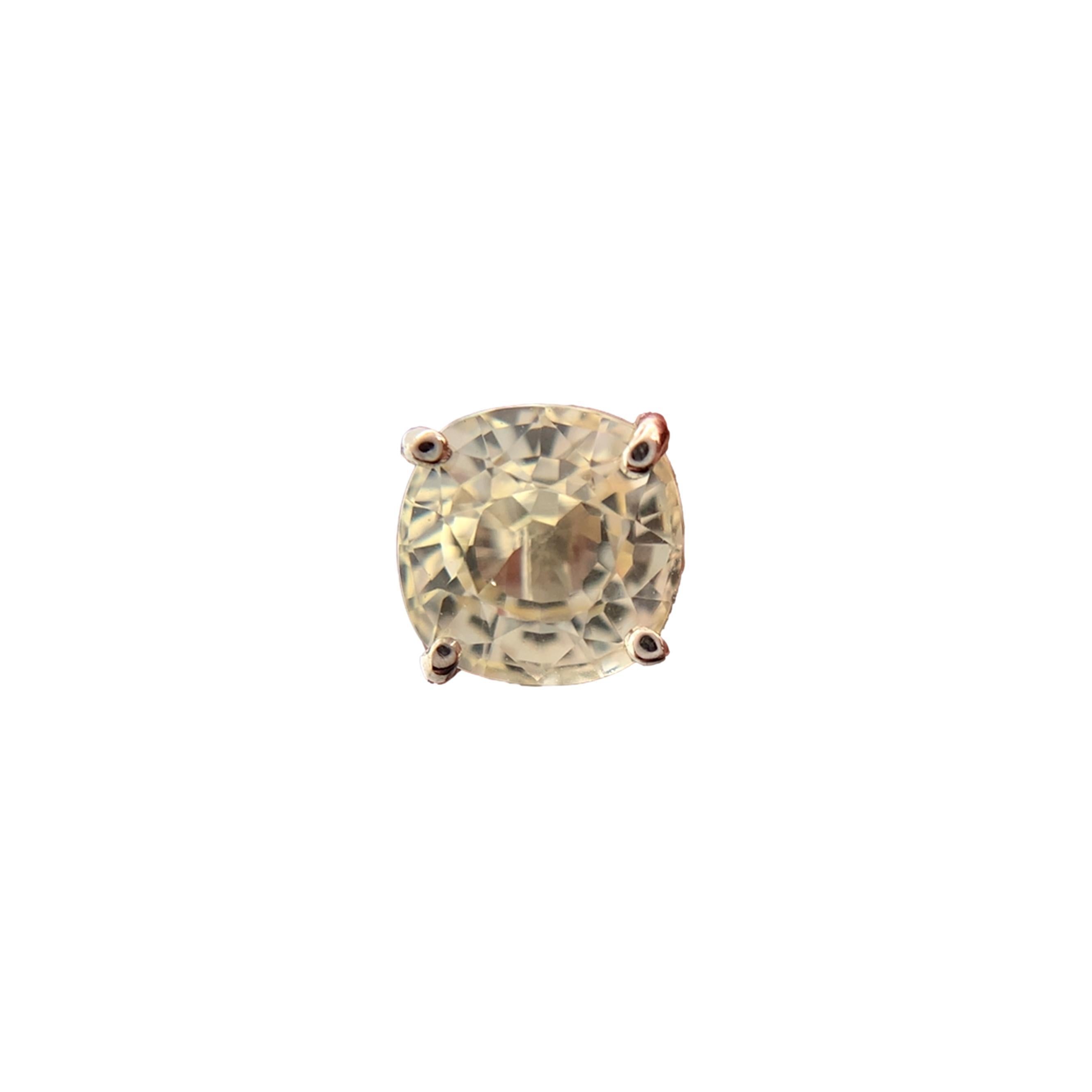 A pair of 14K white gold stud earrings featuring round yellow sapphires. The sapphires are a brilliant pale yellow color. The pair weighs 2.51cts total and measure about 5.6mm. They are natural, unheated. The earring measures just under 1/4